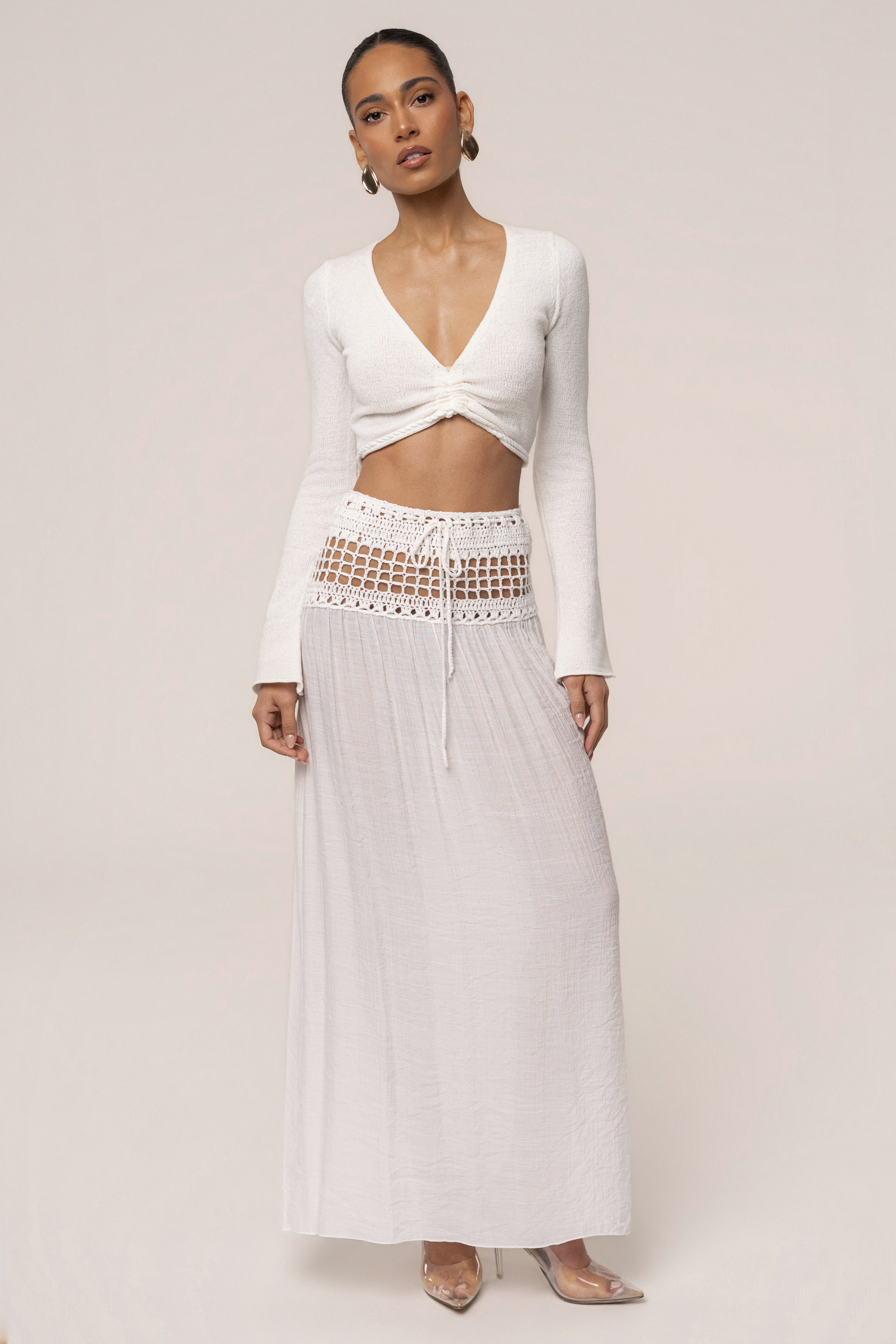 Ivory resort crochet maxi skirt from JLUXLABEL, featuring a flowy, bohemian style with intricate crochet detailing.
