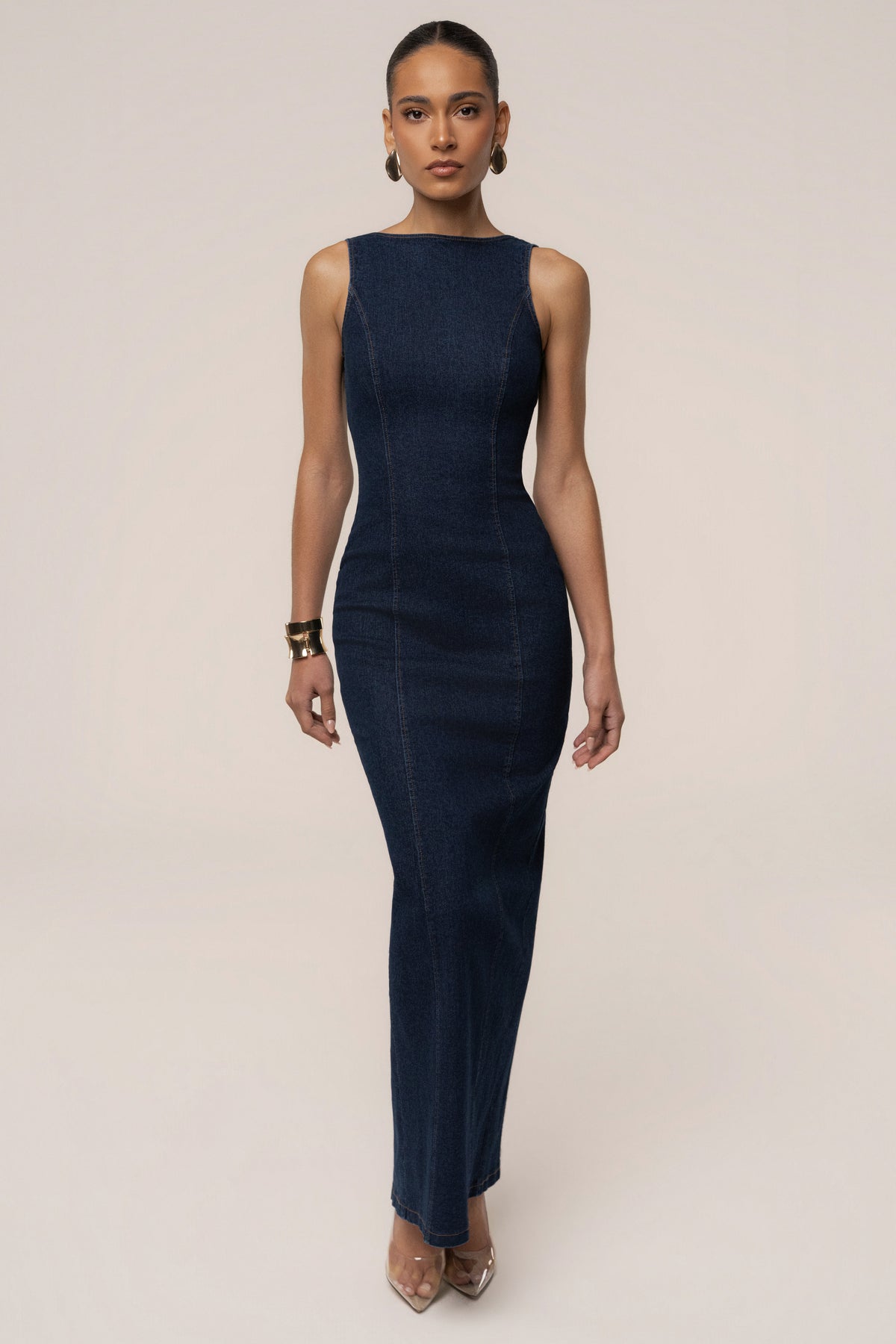 Dark denim JLUXLABEL sculpt maxi dress hanging on a hanger, showcasing its fitted silhouette and stylish design.
