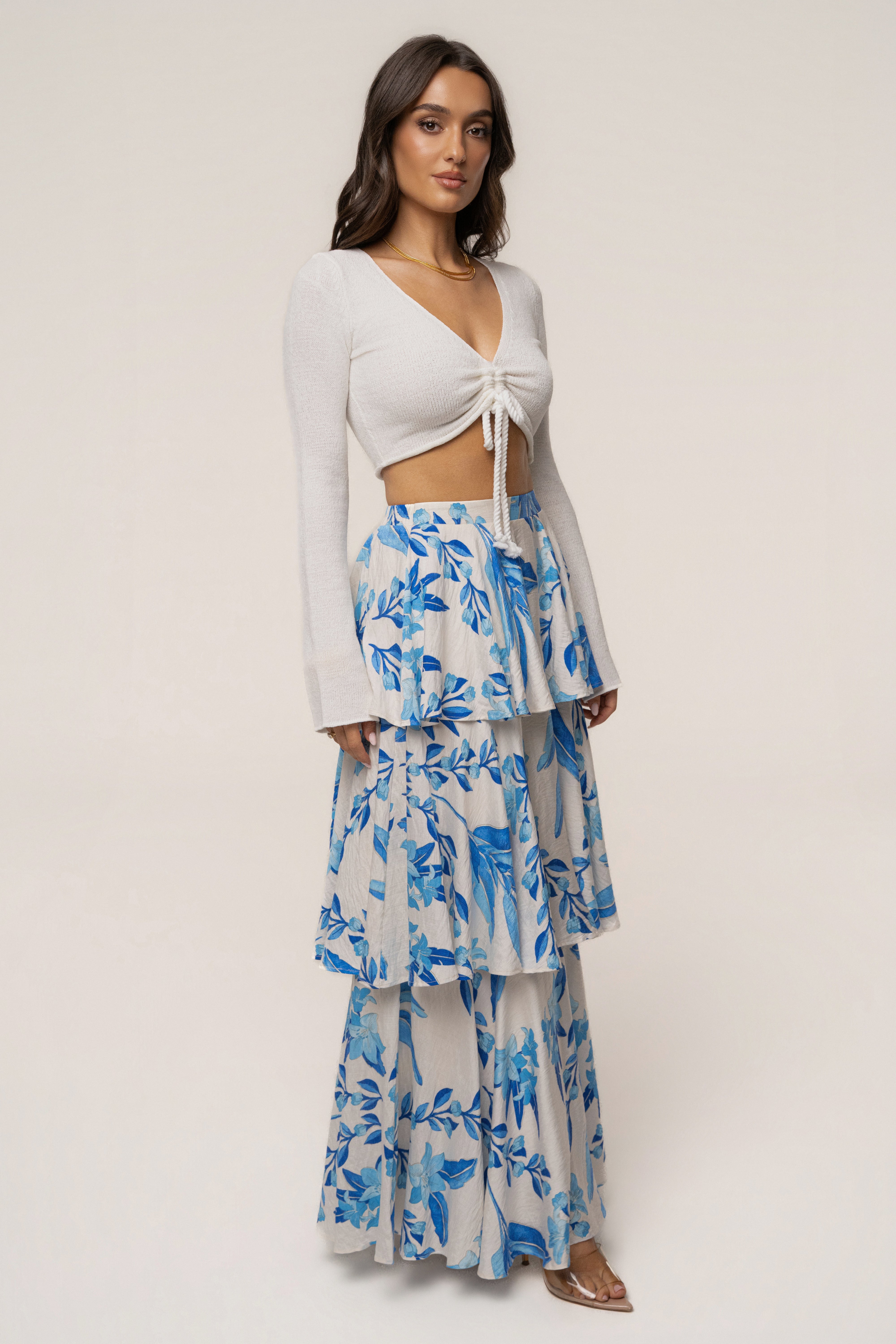 Blue floral Jasmine ruffle maxi skirt by JLUXLABEL, featuring flowing fabric and floral pattern, styled as a stylish women's bottom.