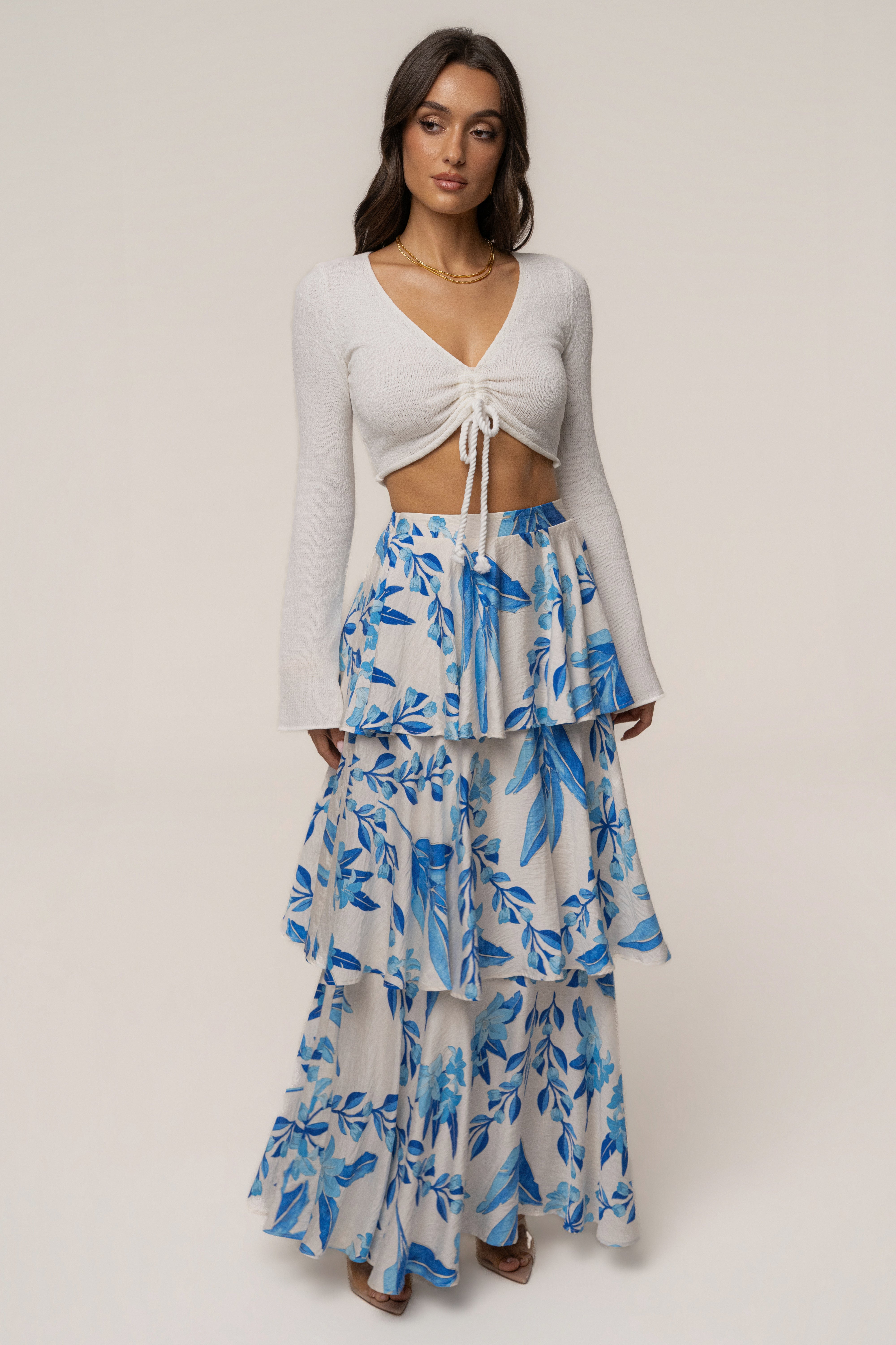 Blue floral Jasmine ruffle maxi skirt by JLUXLABEL, featuring a flowing design with ruffles and a vibrant floral print.