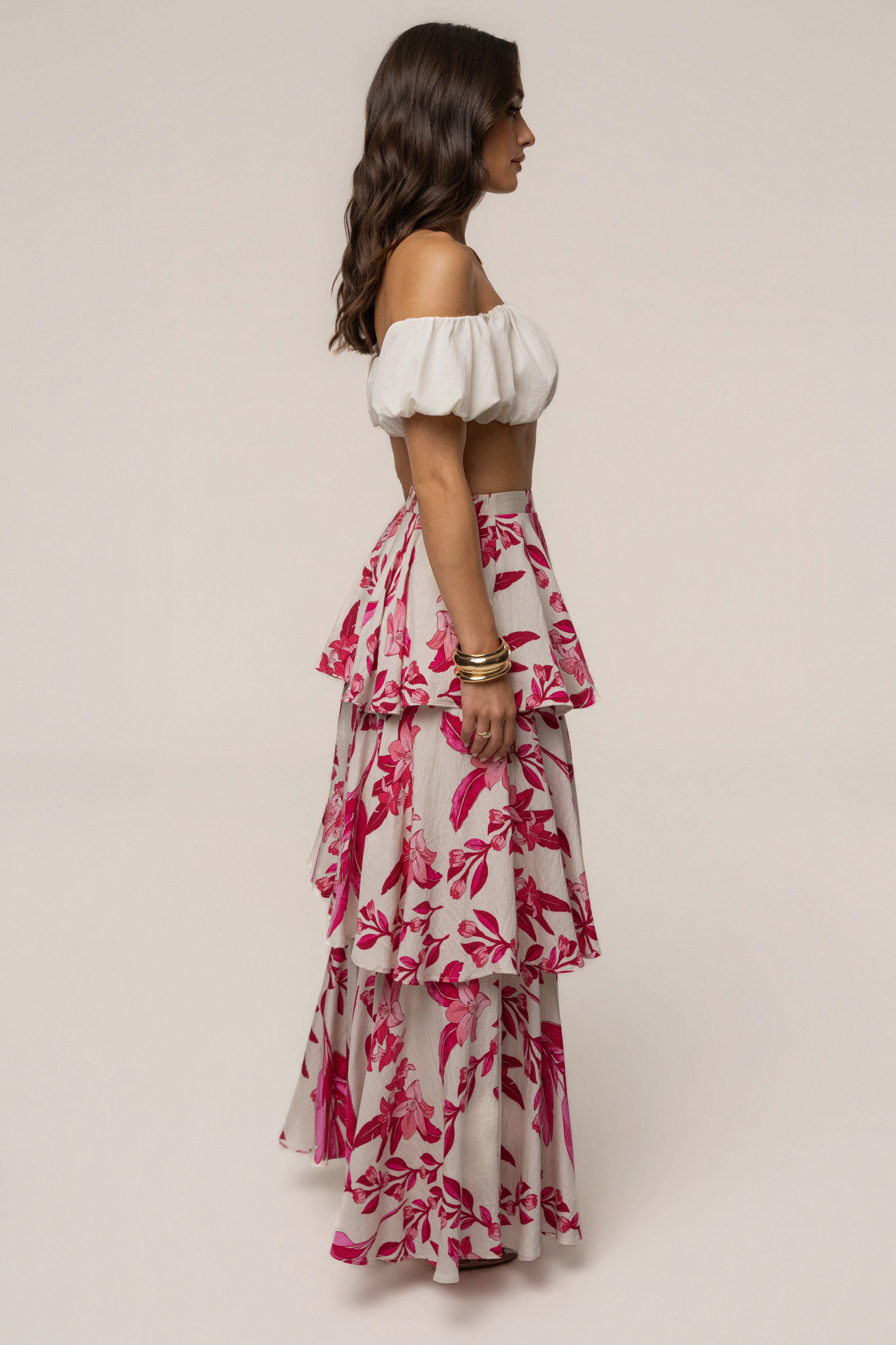 Pink floral Jasmine ruffle maxi skirt by JLUXLABEL, featuring a flowy design with ruffles and a vibrant floral pattern.