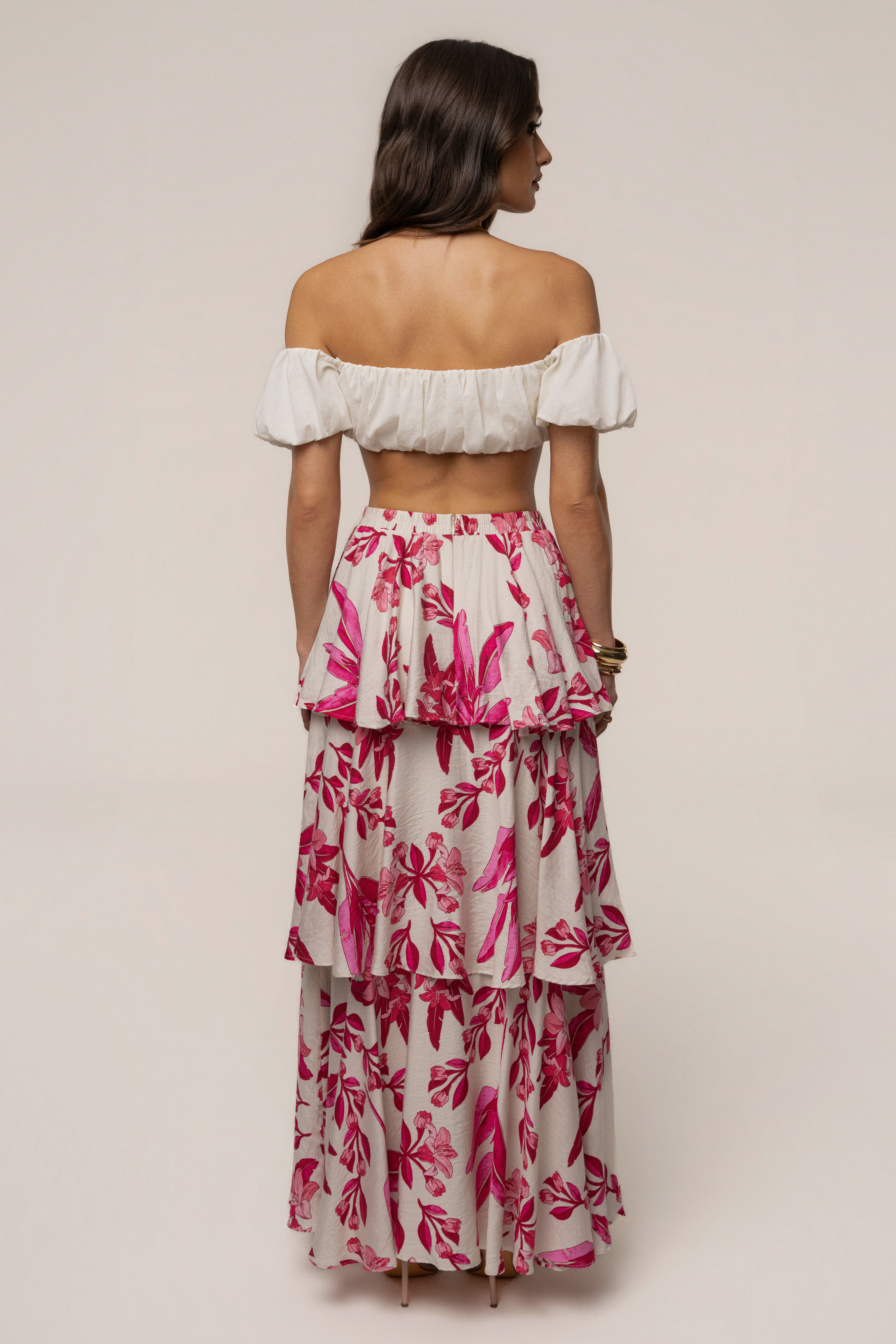Pink floral jasmine ruffle maxi skirt by JLUXLABEL, featuring flowing fabric and ruffle details, perfect for stylish summer looks.