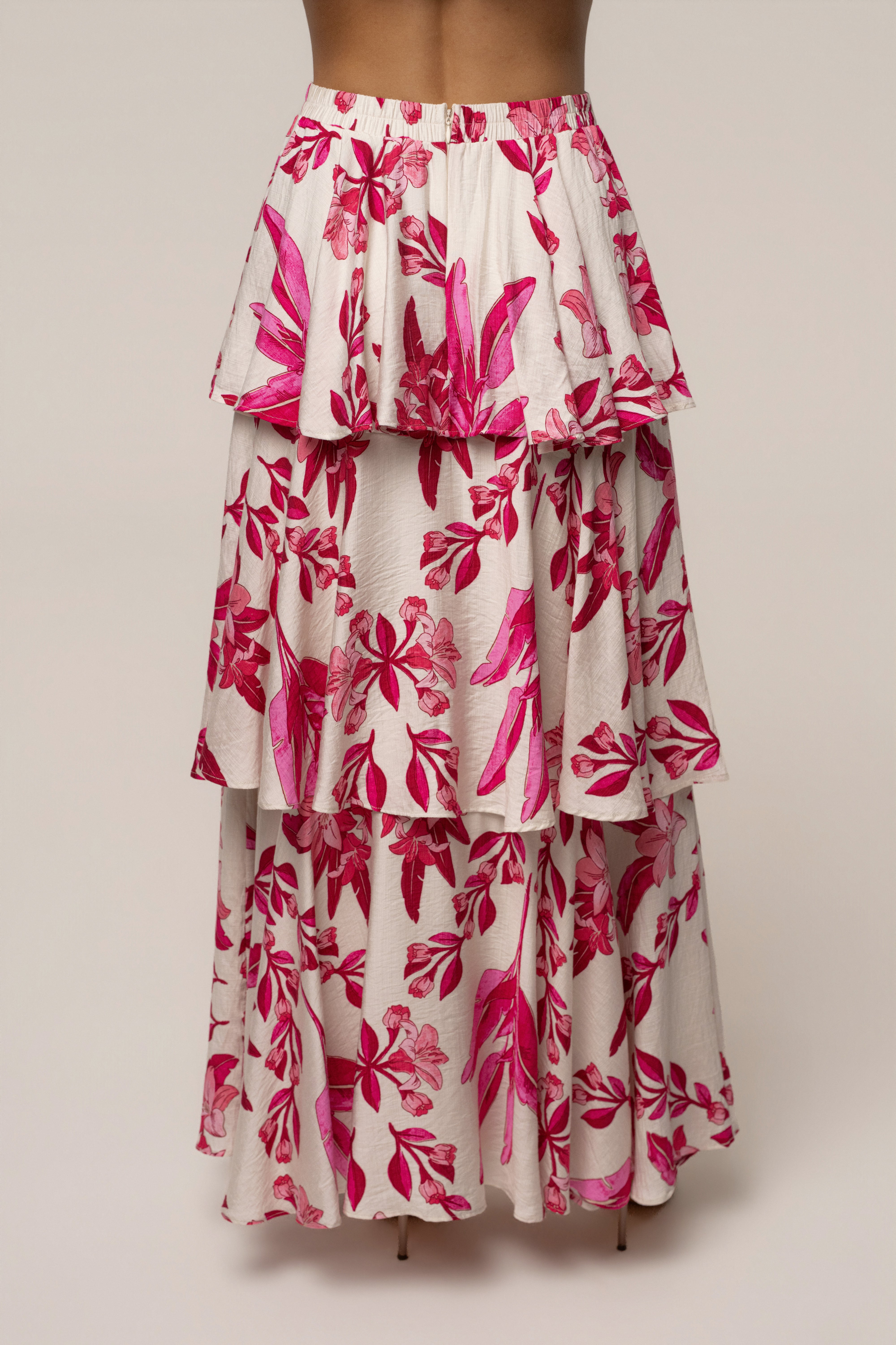Pink floral Jasmine ruffle maxi skirt by JLUXLABEL, featuring a flowy design with ruffled details, perfect for feminine summer looks.