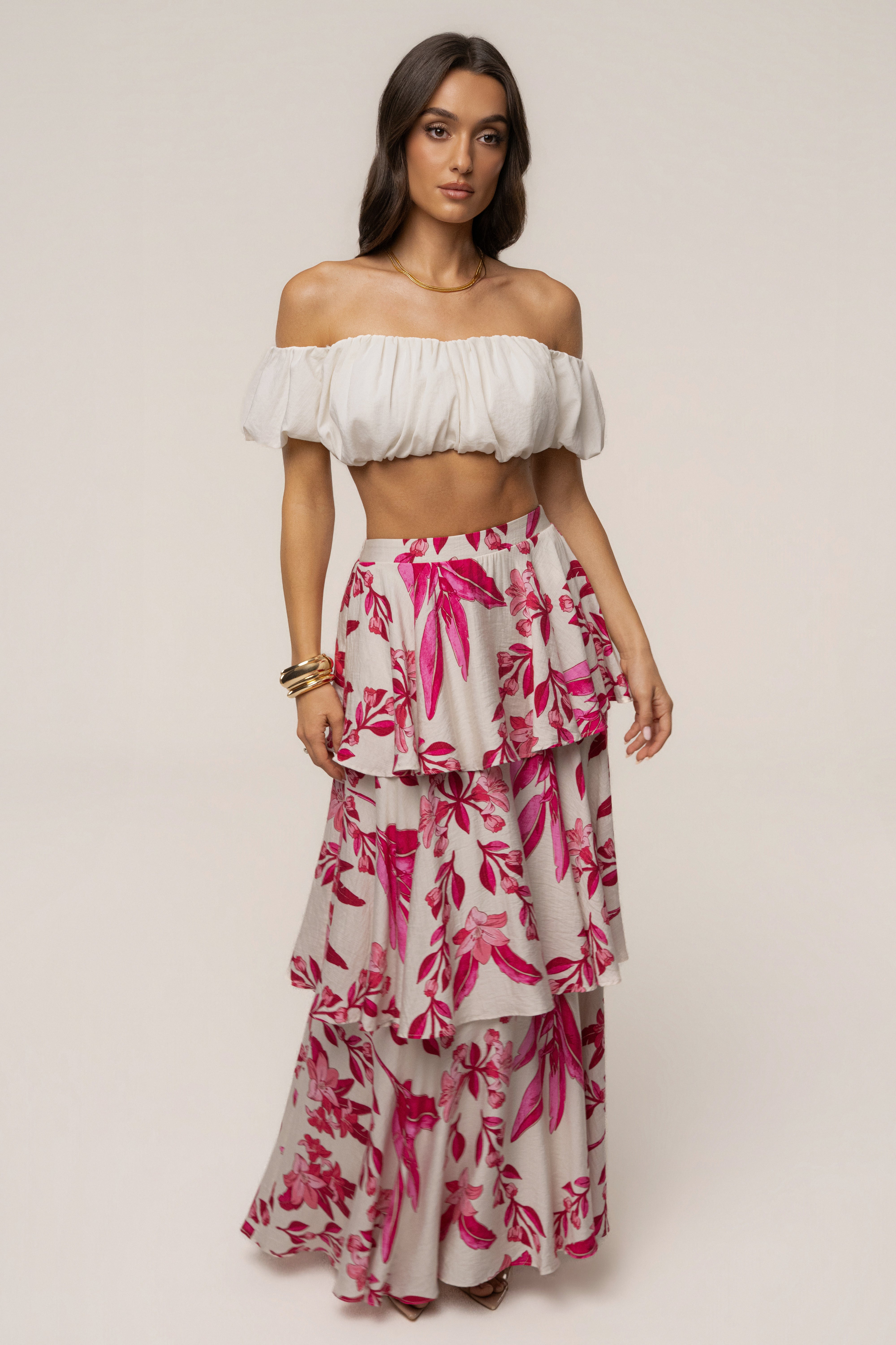 Pink floral jasmine ruffle maxi skirt from JLUXLABEL, flowing bottoms with ruffle details and vibrant floral print.