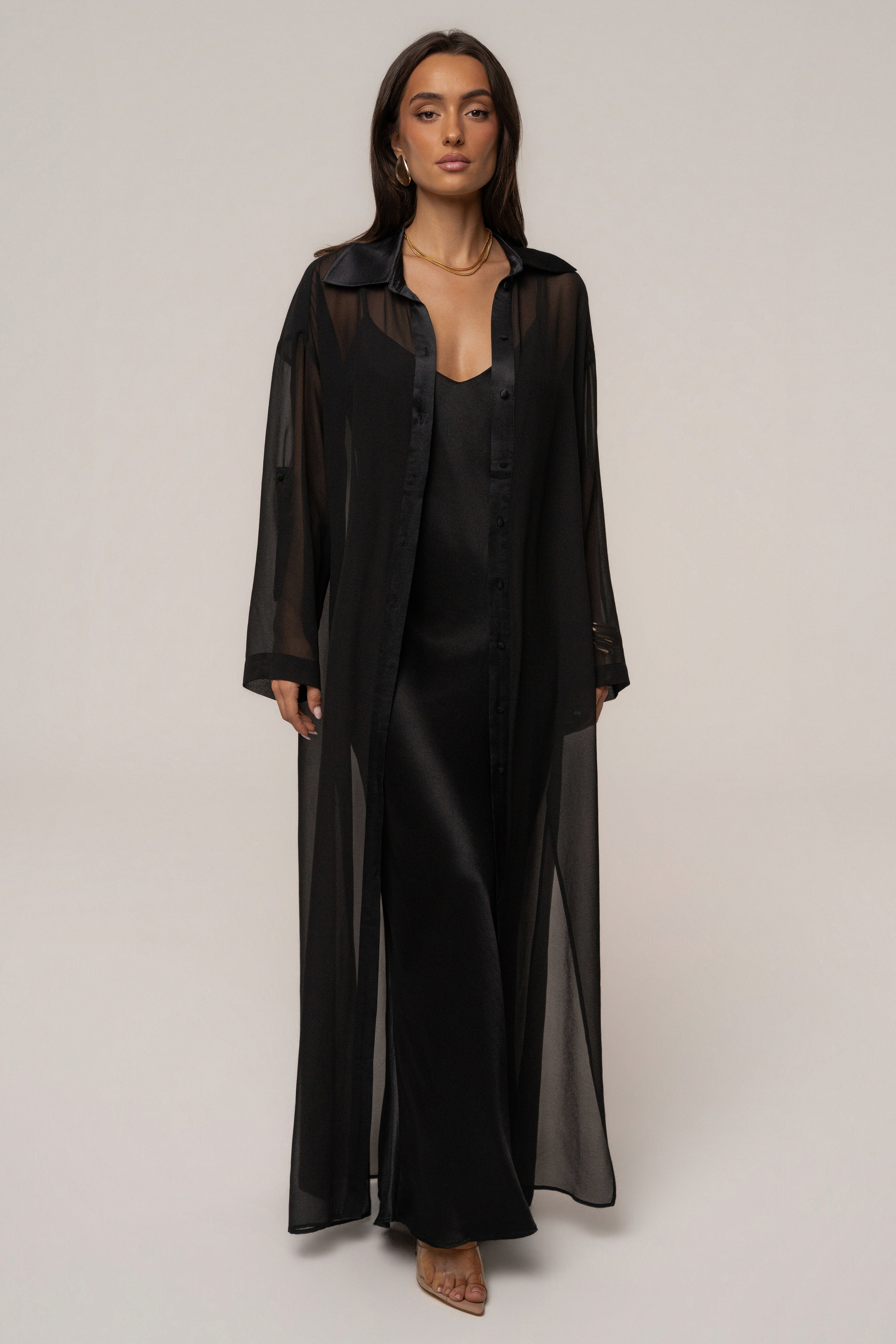 Black Promise Satin Maxi Dress by JLUXLABEL with flowing fabric and elegant design, perfect for formal occasions.