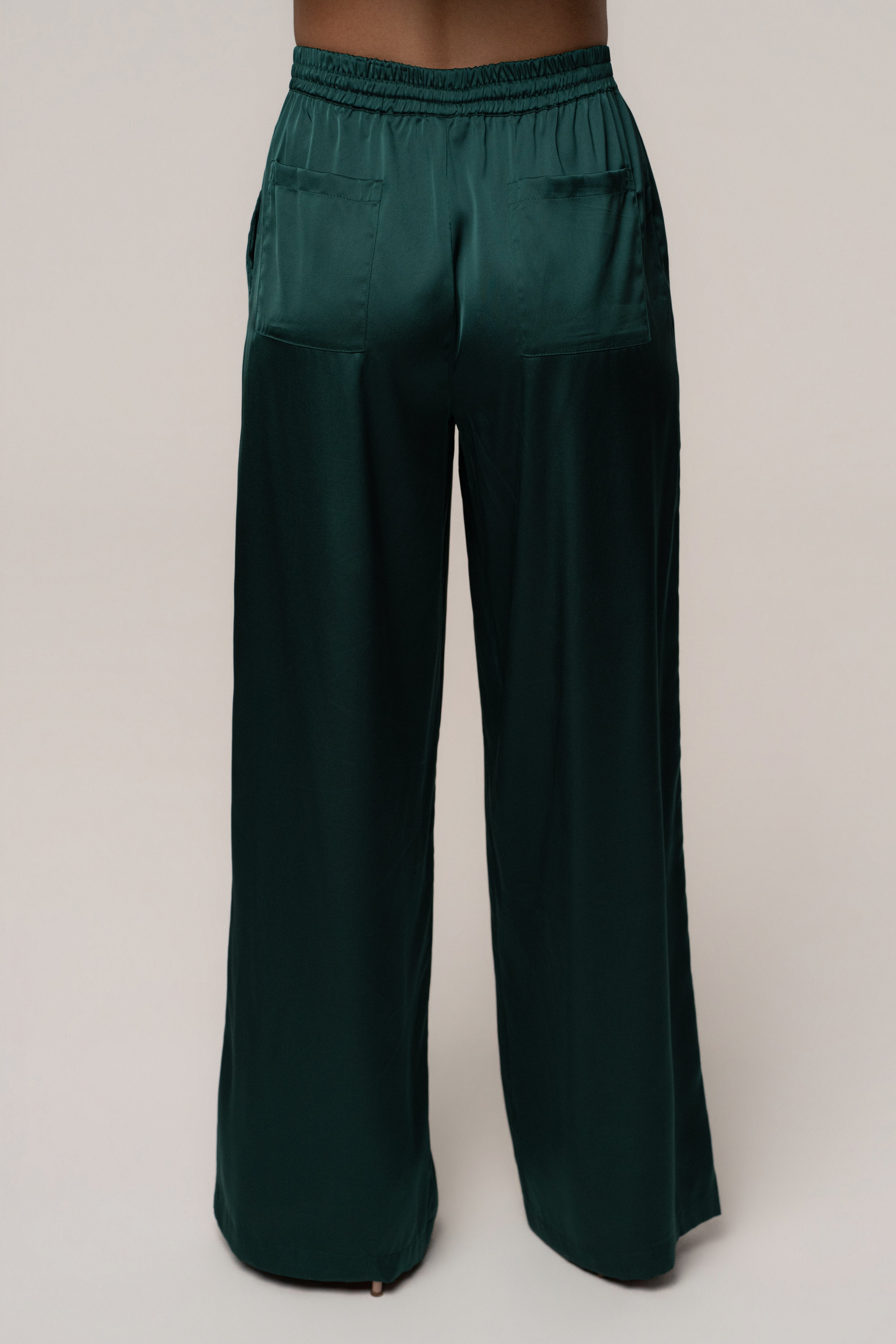 Emerald green JLUXLABEL Sunny Day Drawstring Pants, stylish bottoms with a comfortable fit, shown in a natural pose.