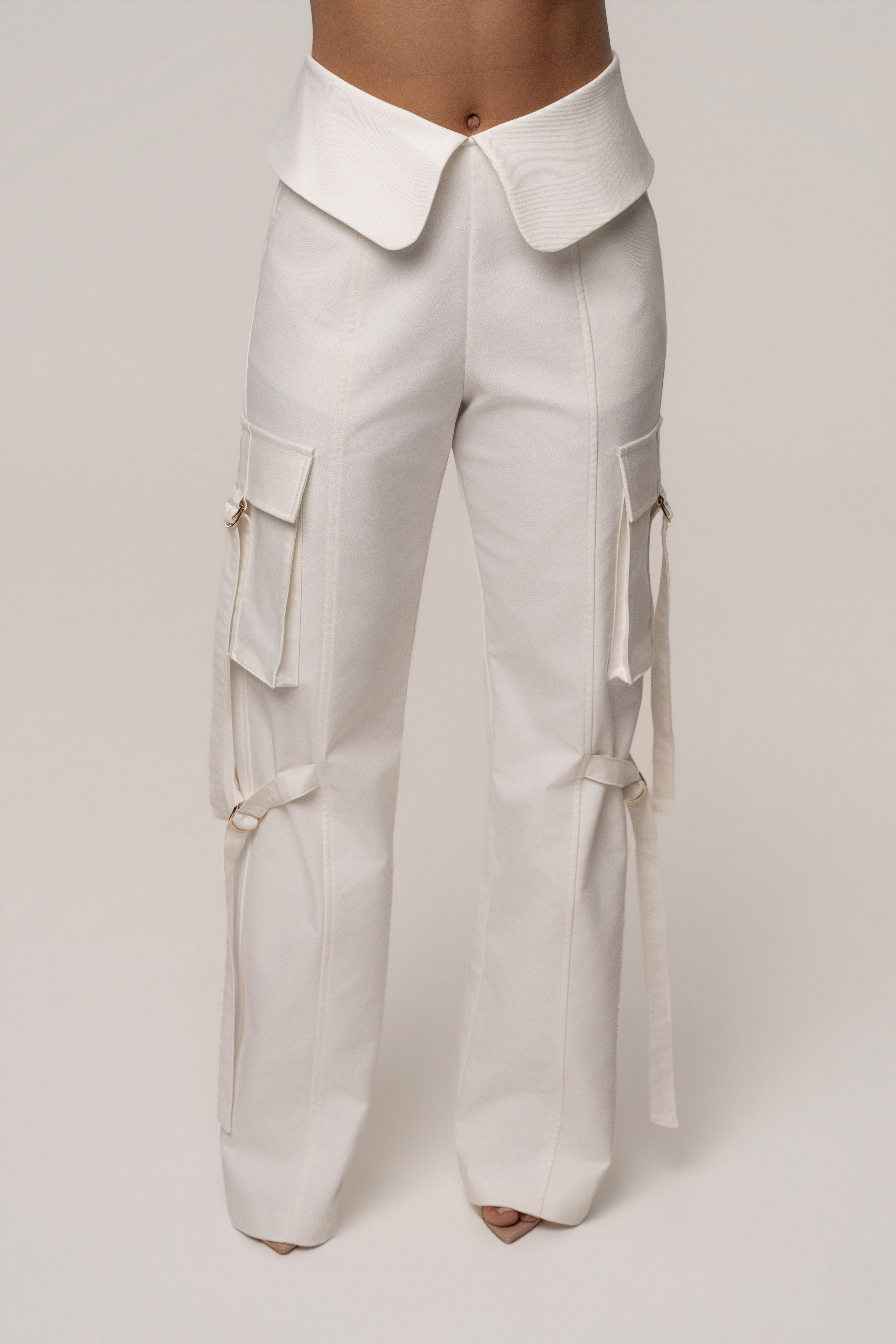 JLUXLABEL Cream Downtown Cargo Pants, stylish bottoms with multiple pockets, shown in new color on a model.