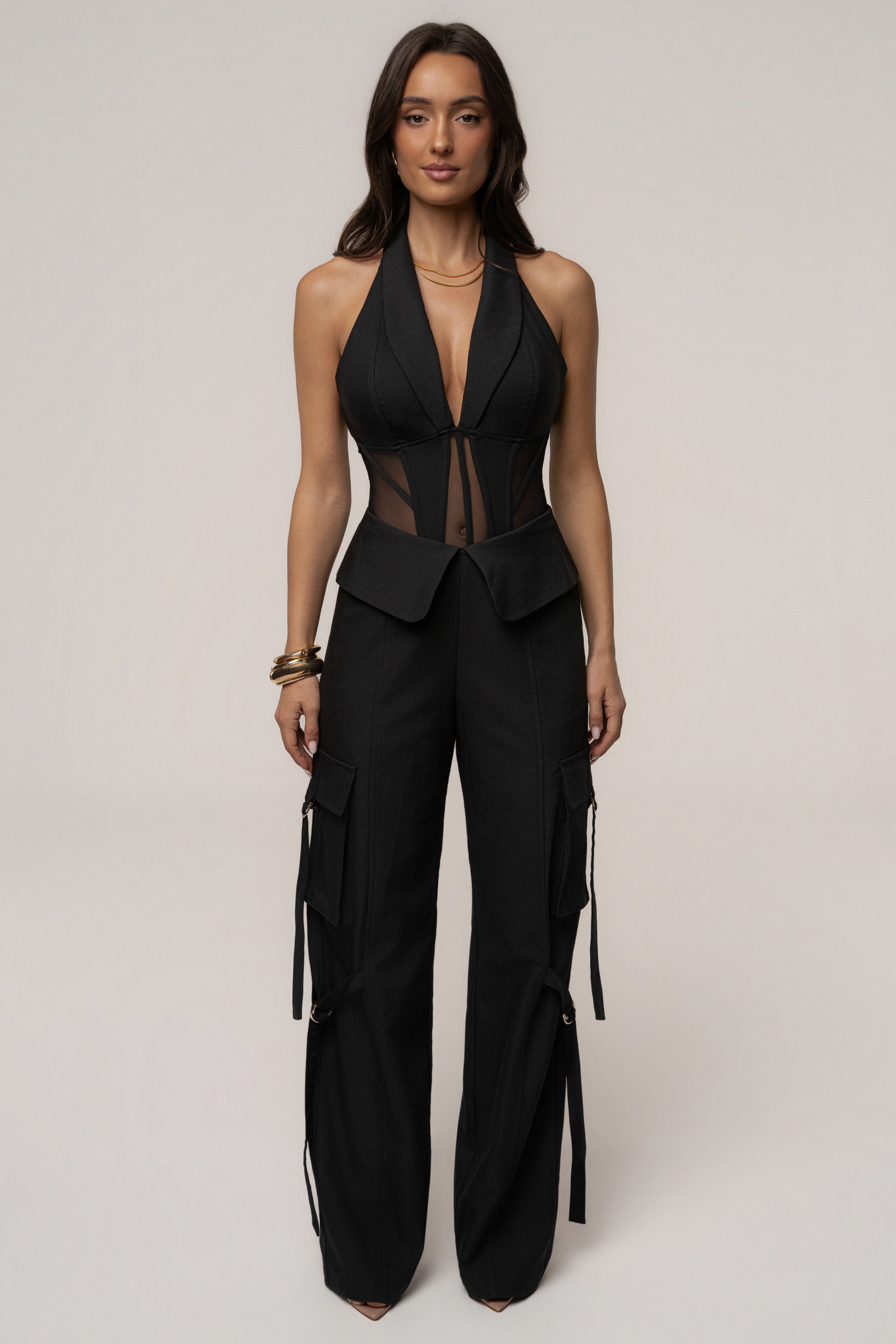 Black JLUXLABEL Downtown Cargo Pant with multiple pockets, relaxed fit, and tapered legs shown on a model.