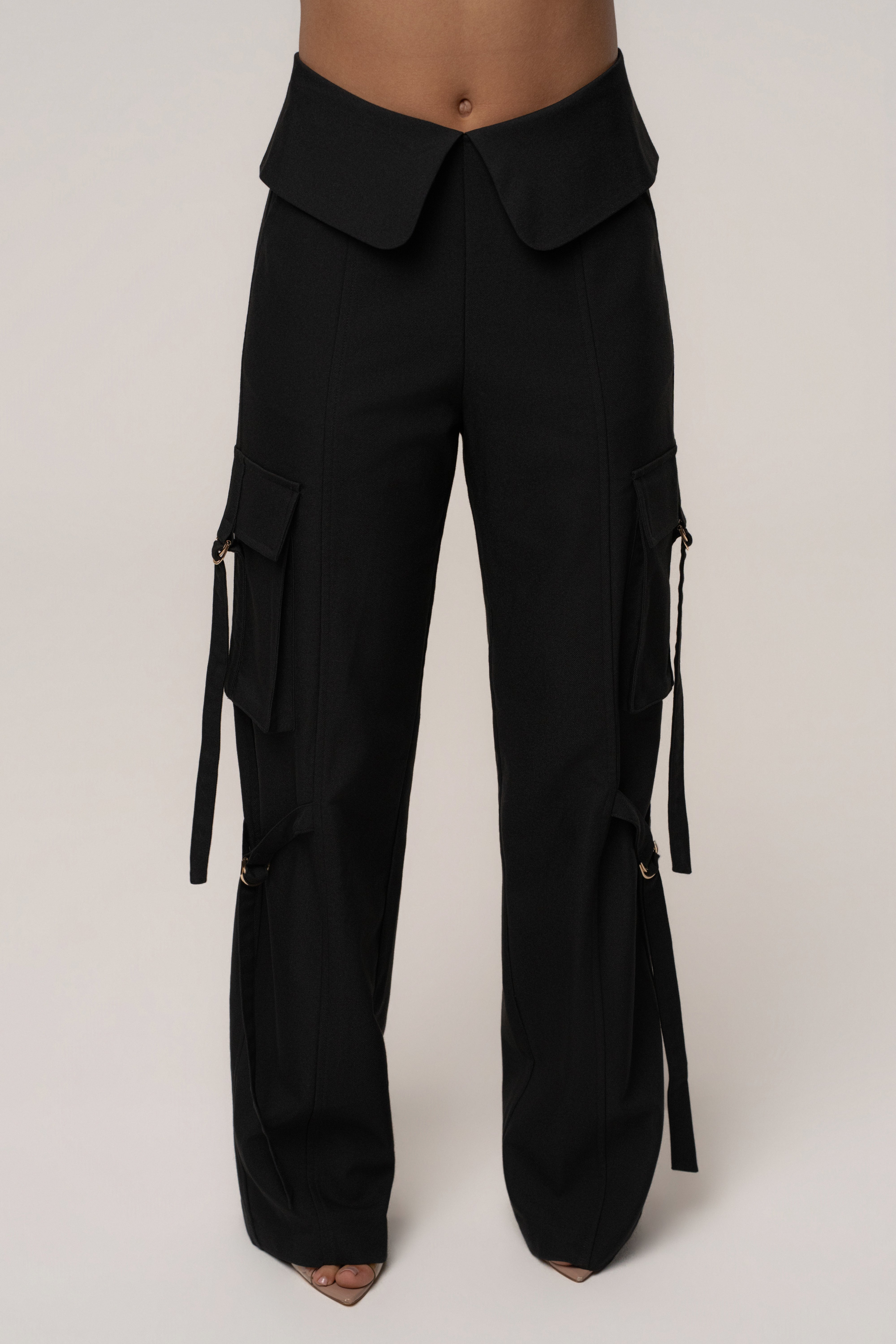 Black JLUXLABEL Downtown Cargo Pant shown on a model, featuring a relaxed fit with multiple pockets and casual style.