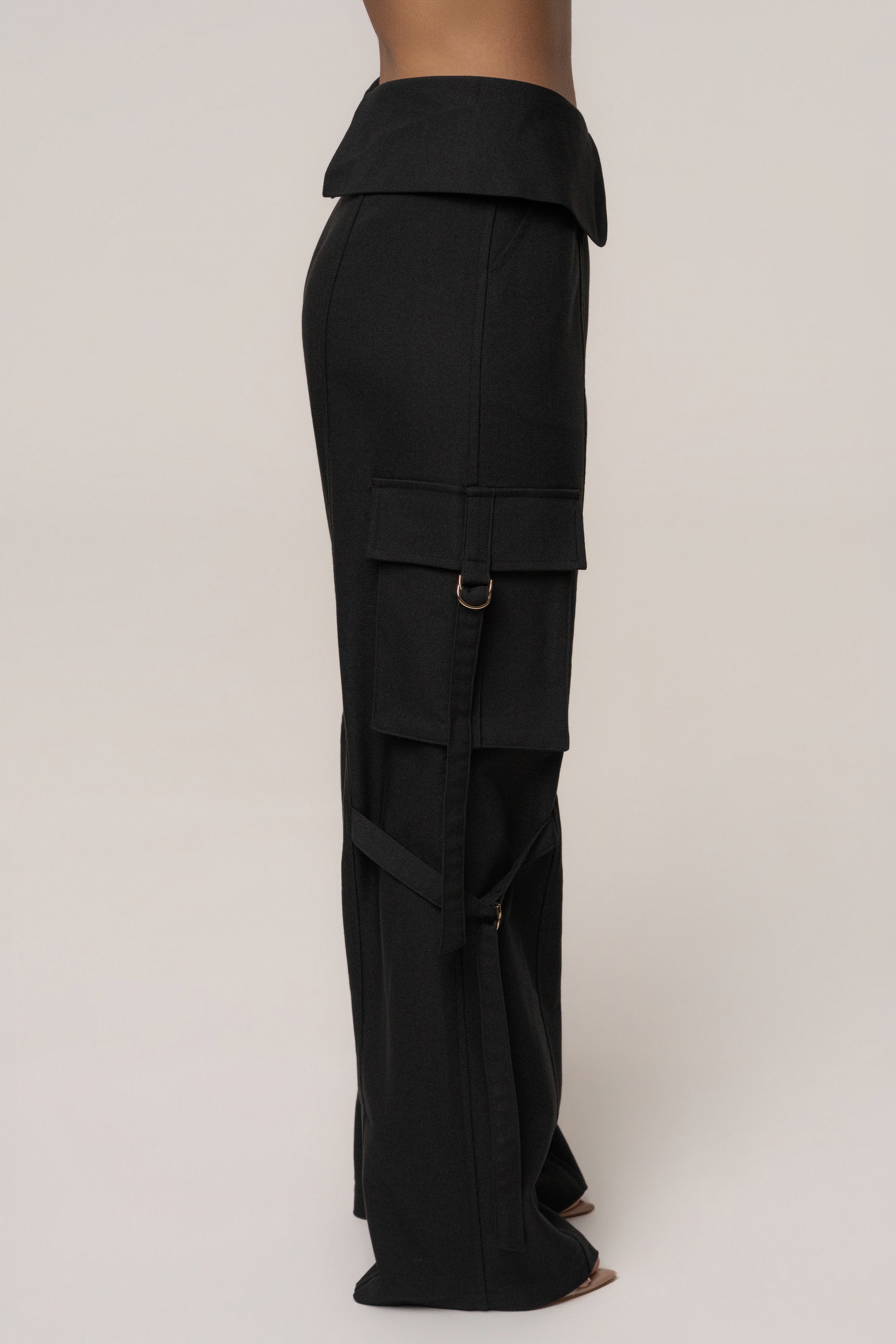 Black JLUXLABEL Downtown Cargo Pant, stylish bottoms with multiple pockets, shown in a relaxed fit on a model.