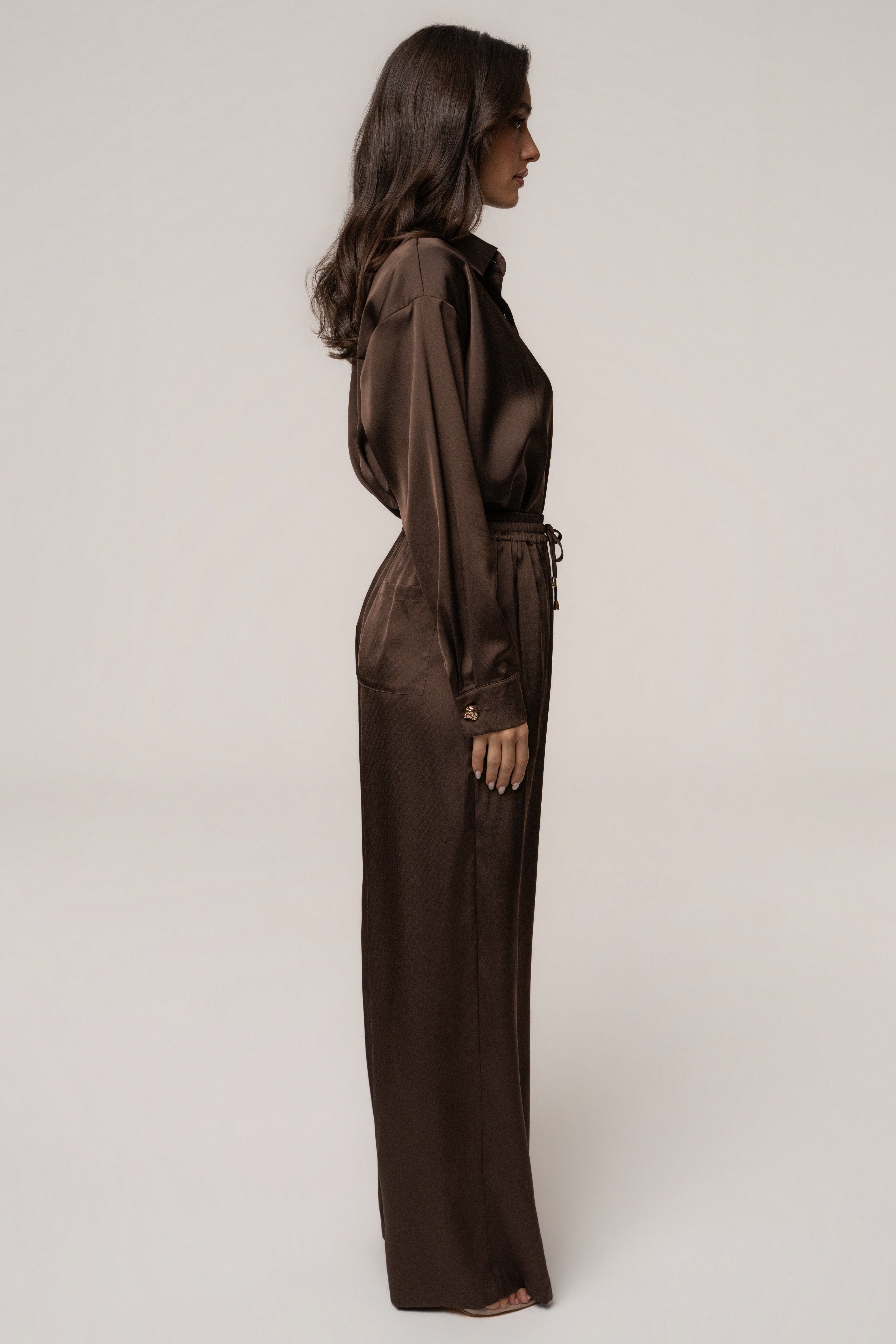 Chocolate Sunny Day Drawstring Pants by JLUXLABEL, stylish bottoms with a relaxed fit and drawstring waist, shown in a natural fabric appearance.