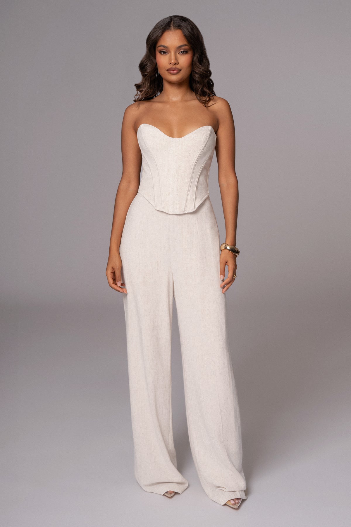 JLUXLABEL Natural Beyond The Sea Linen Corset top, light beige, fitted with adjustable straps and intricate linen texture.