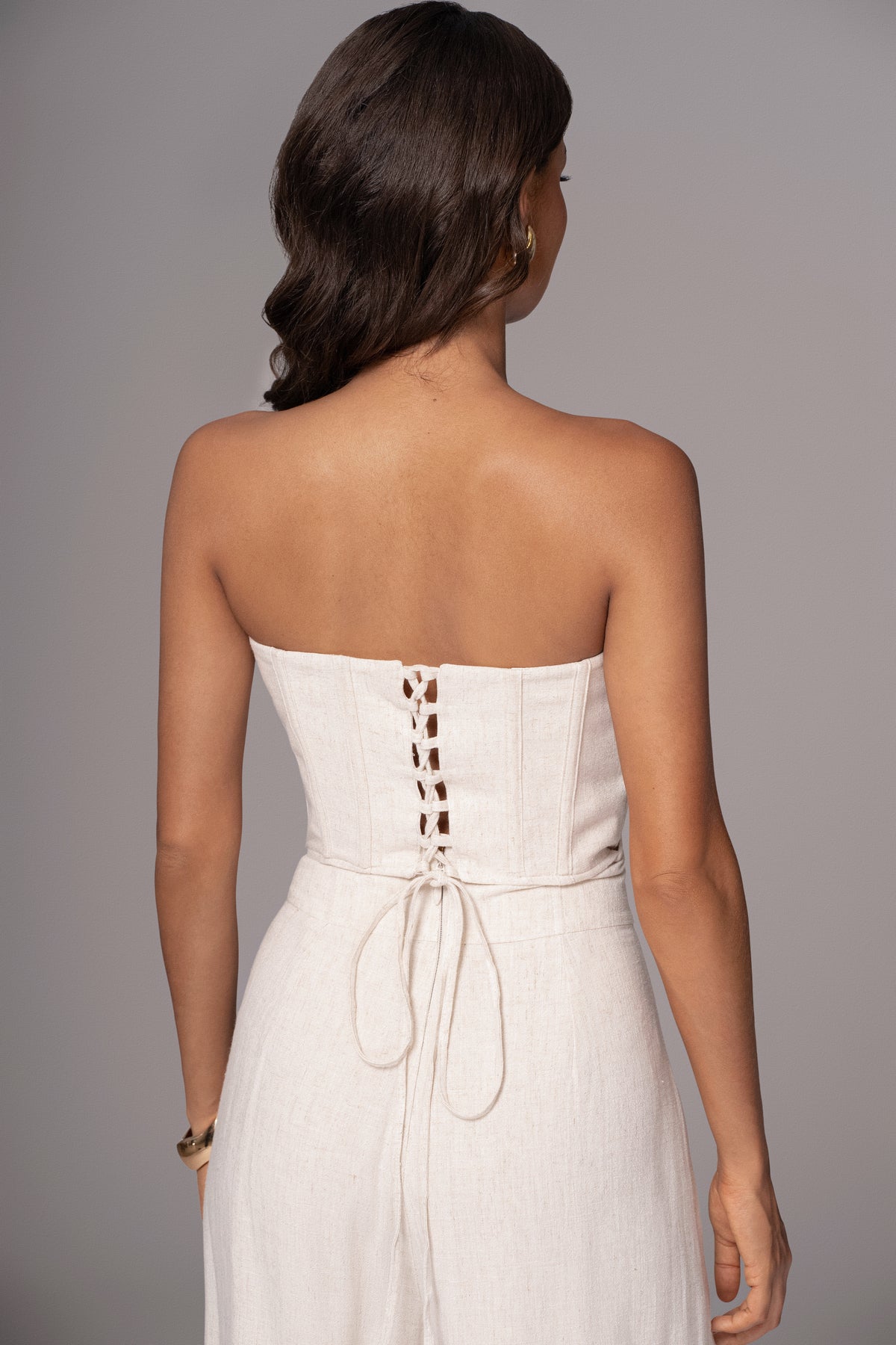 JLUXLABEL Natural Beyond The Sea linen corset top featuring a fitted design and soft fabric with adjustable straps.