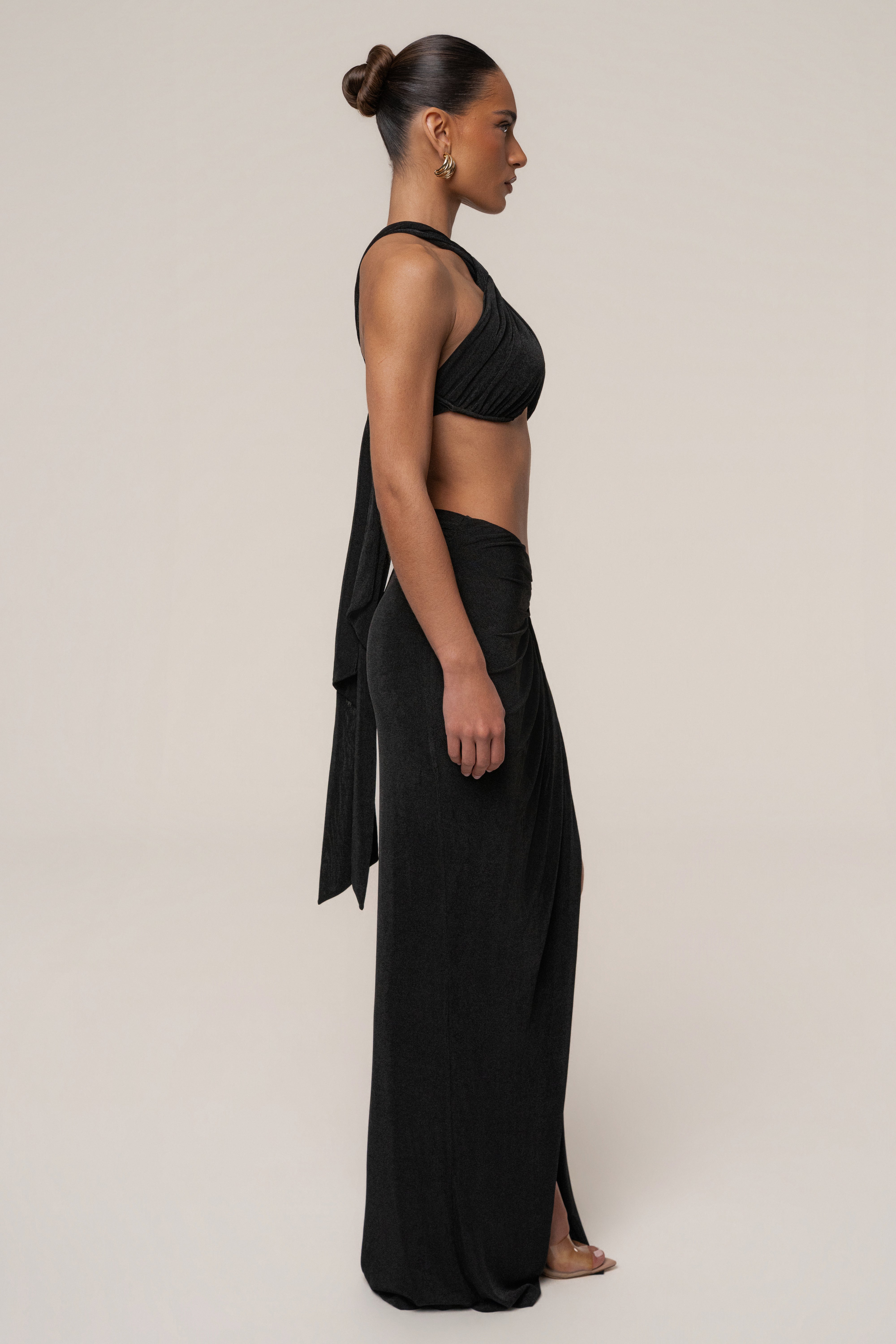 Black City After Dark skirt set by JLUXLABEL featuring a stylish matching top and skirt ensemble on a model.