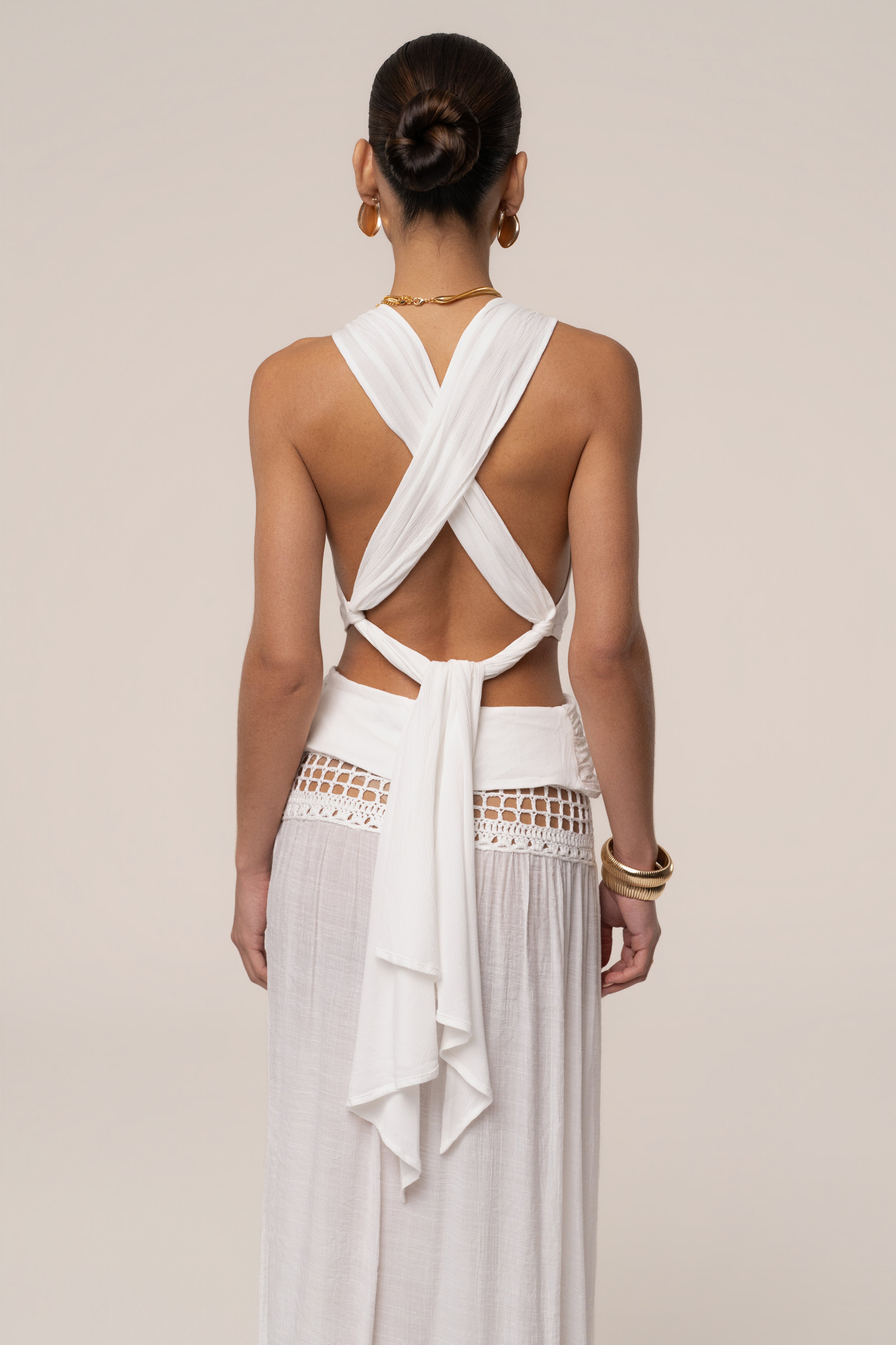 White Tulum Drape Top by JLUXLABEL, stylish women's top with draped fabric and relaxed fit, made from lightweight material.