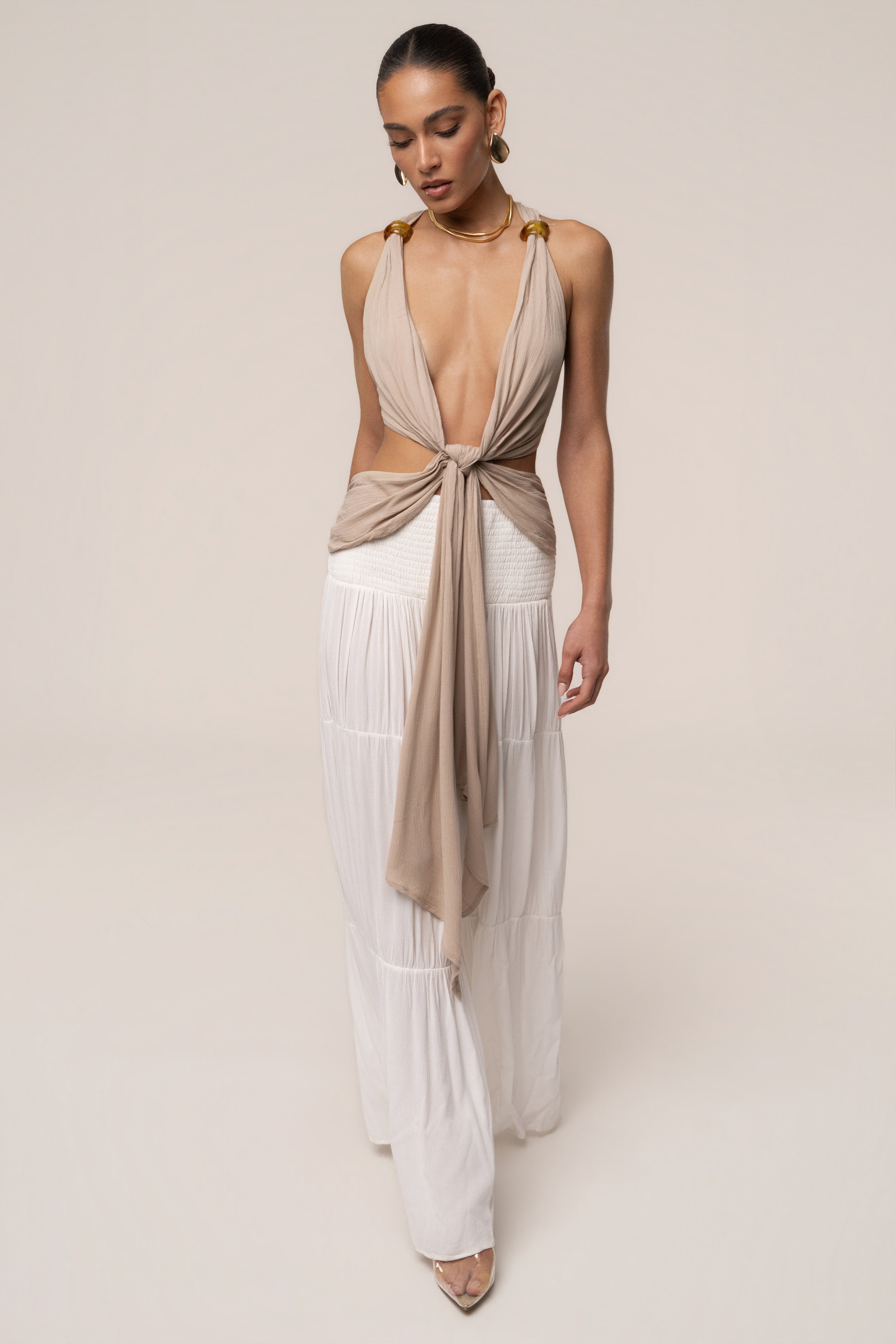 Beige Tulum Drape Top by JLUXLABEL, featuring a relaxed fit and draped design, shown on a model.