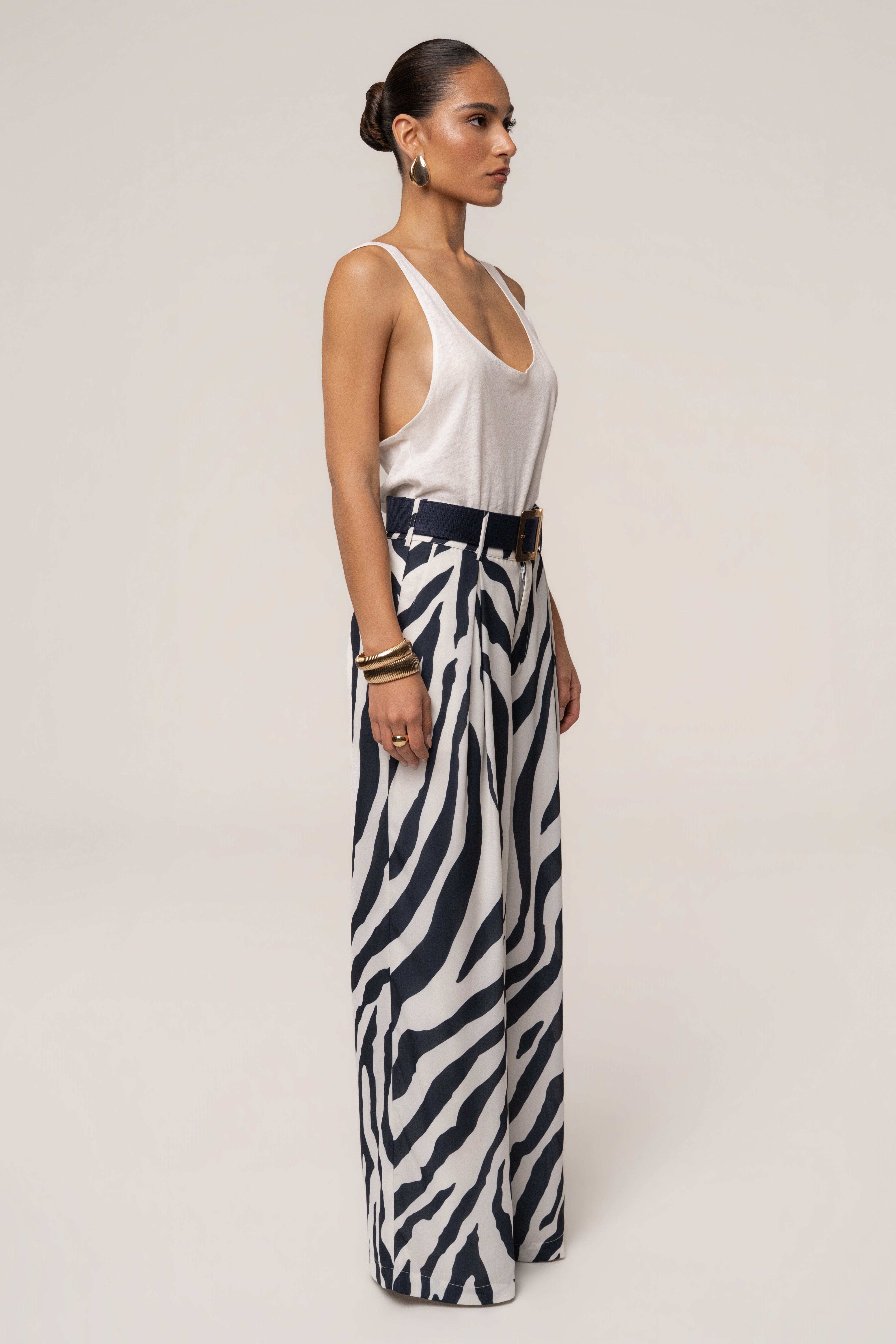 Navy zebra soft pleated trousers by JLUXLABEL, stylish bottoms with a relaxed fit and pleated design, perfect for casual or chic looks.