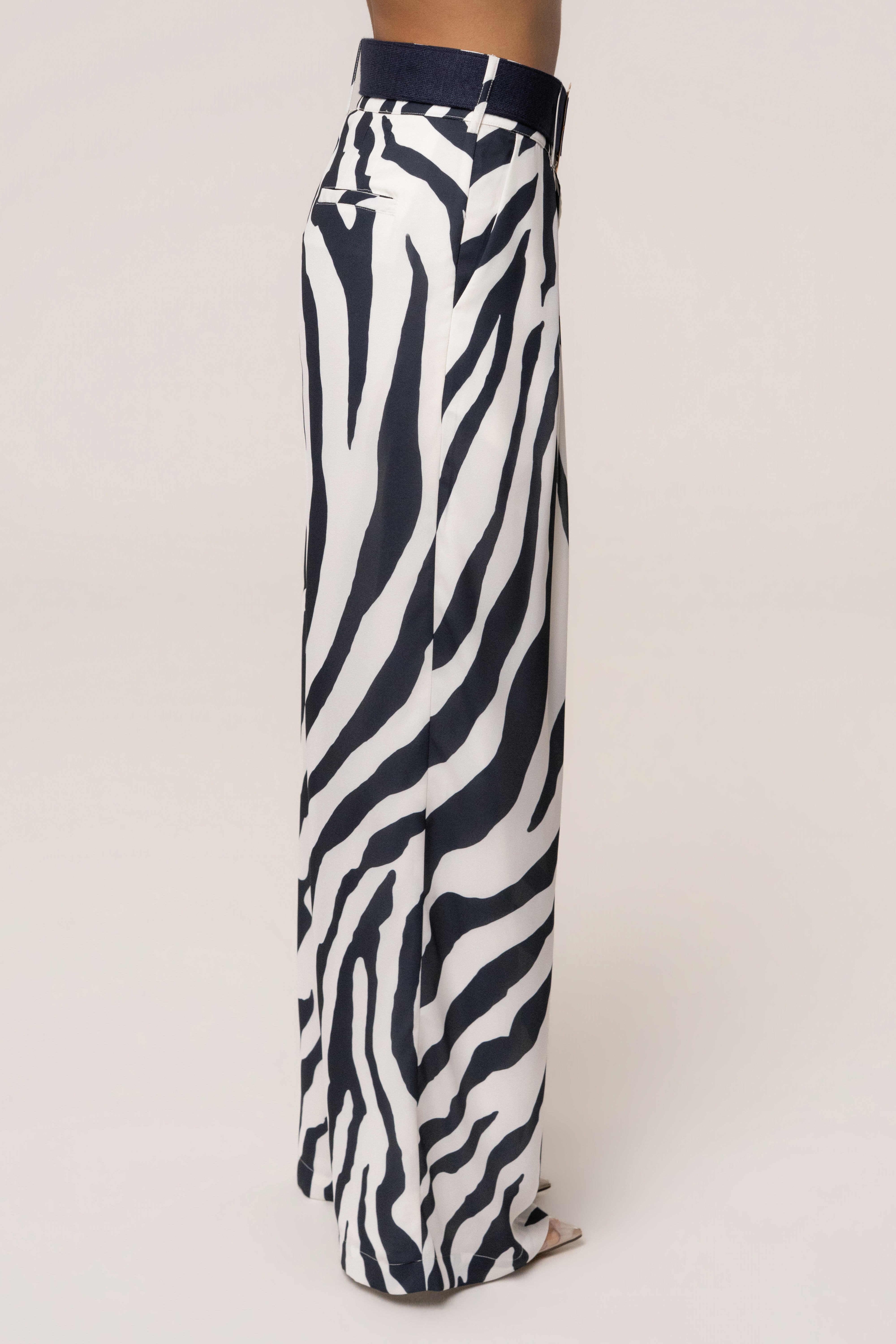 Navy zebra soft pleated trousers by JLUXLABEL, stylish bottoms with a relaxed fit and pleated design, shown on a model.