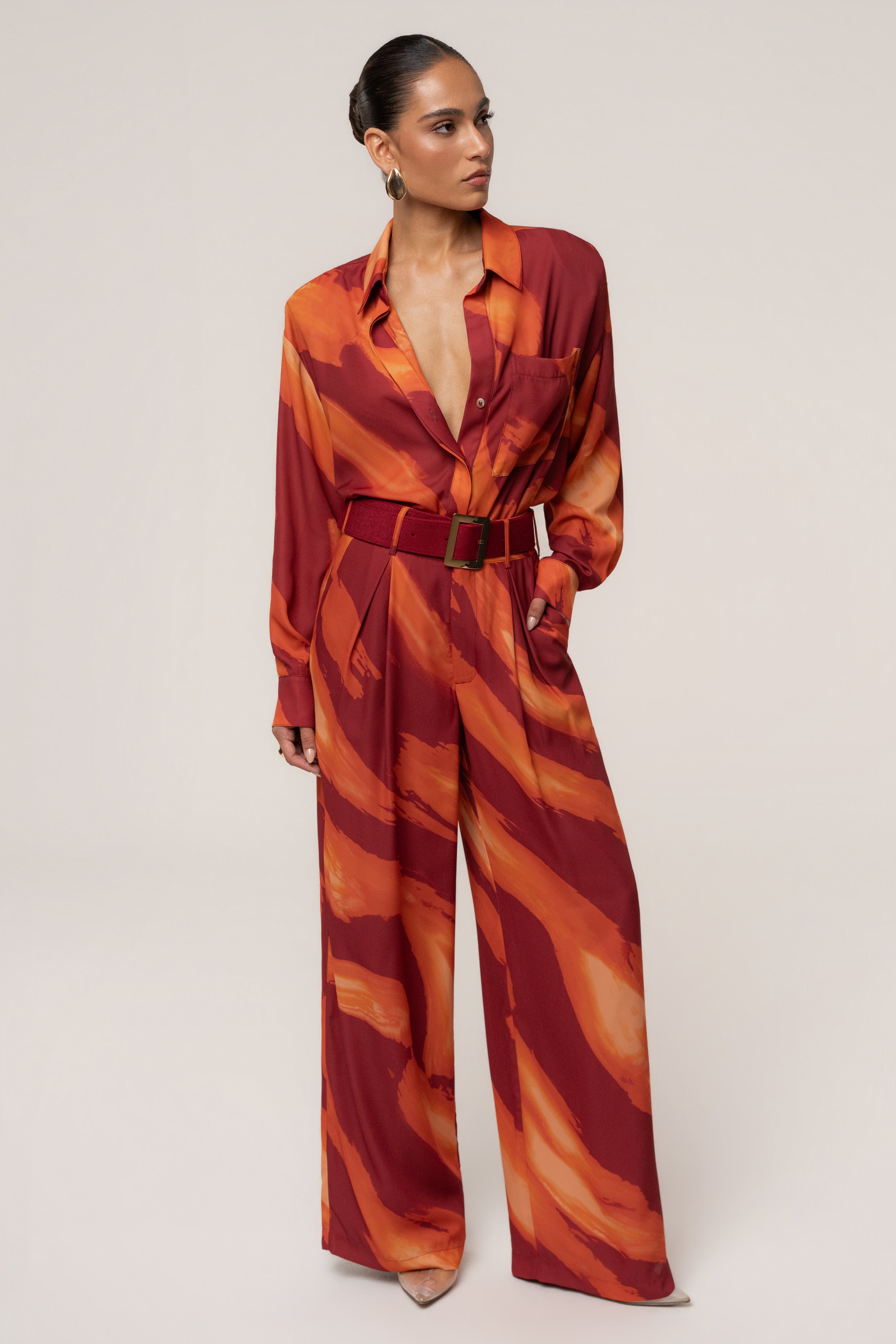 Crimson Dusk soft pleated trousers by JLUXLABEL, stylish bottoms with a relaxed fit and elegant pleats, shown on a model.