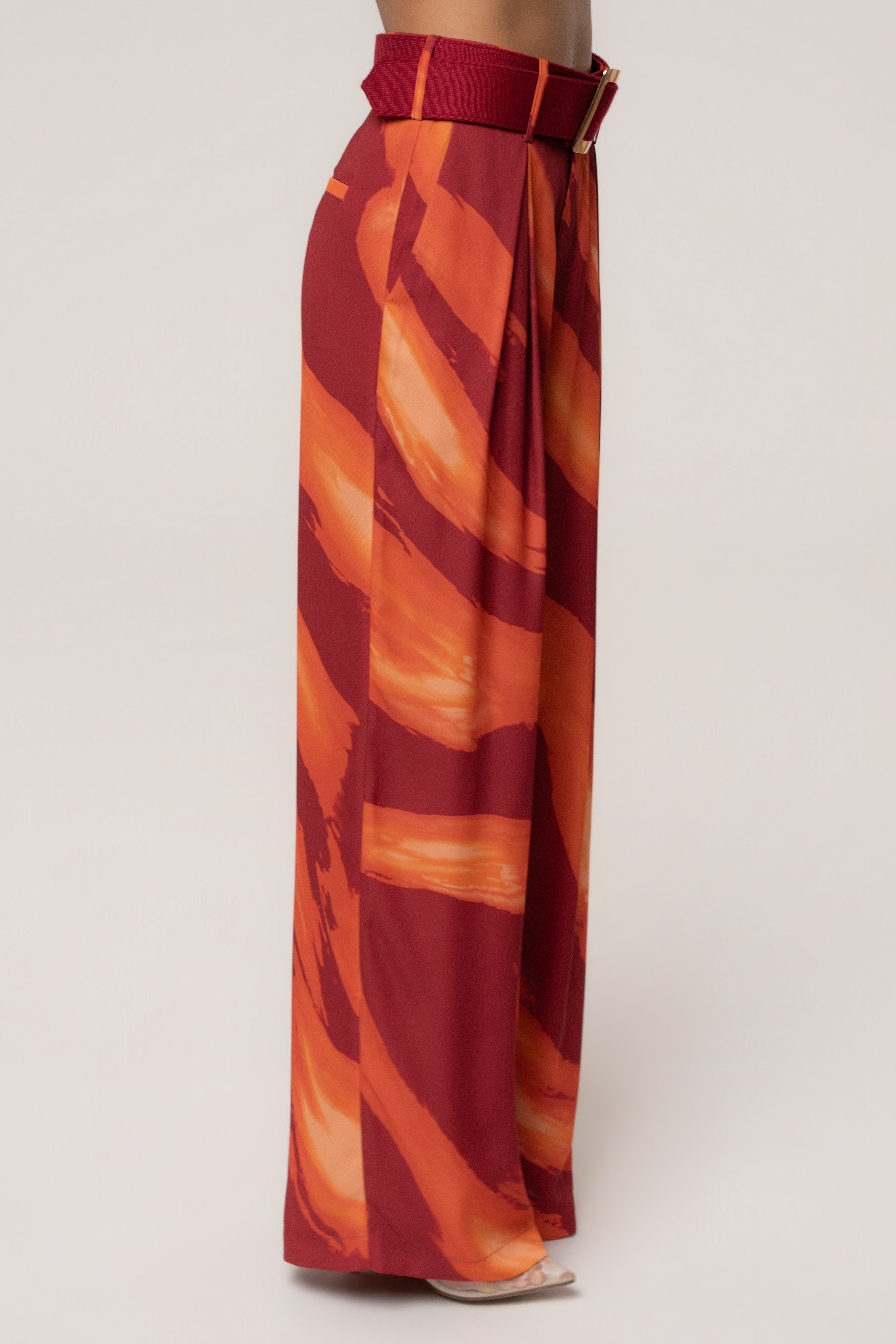 Crimson Dusk JLUXLABEL soft pleated trousers, stylish bottoms with a relaxed fit and tailored waistband, shown on a model.