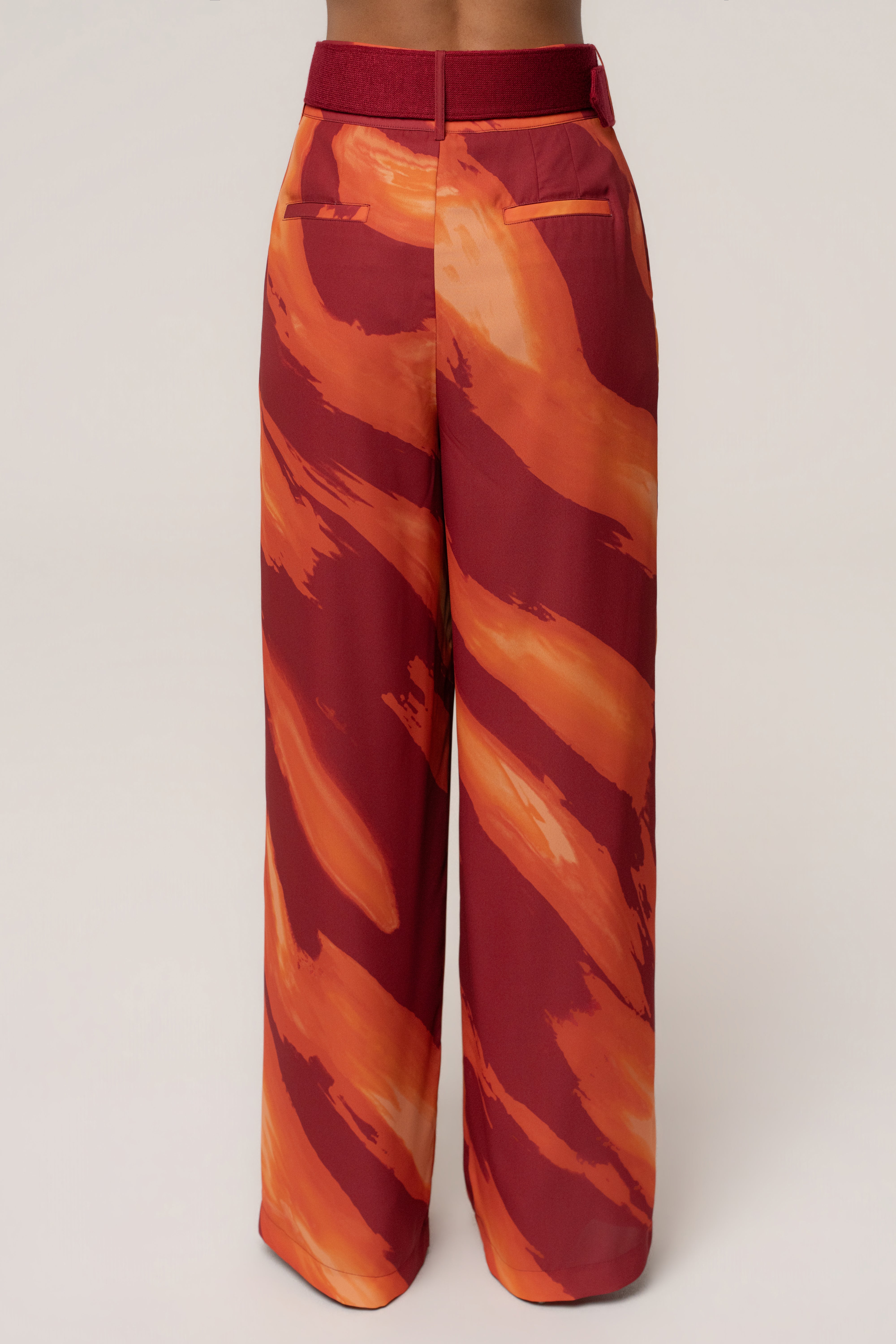 Crimson Dusk soft pleated trousers by JLUXLABEL, stylish women's bottoms with a relaxed fit and elegant pleats.
