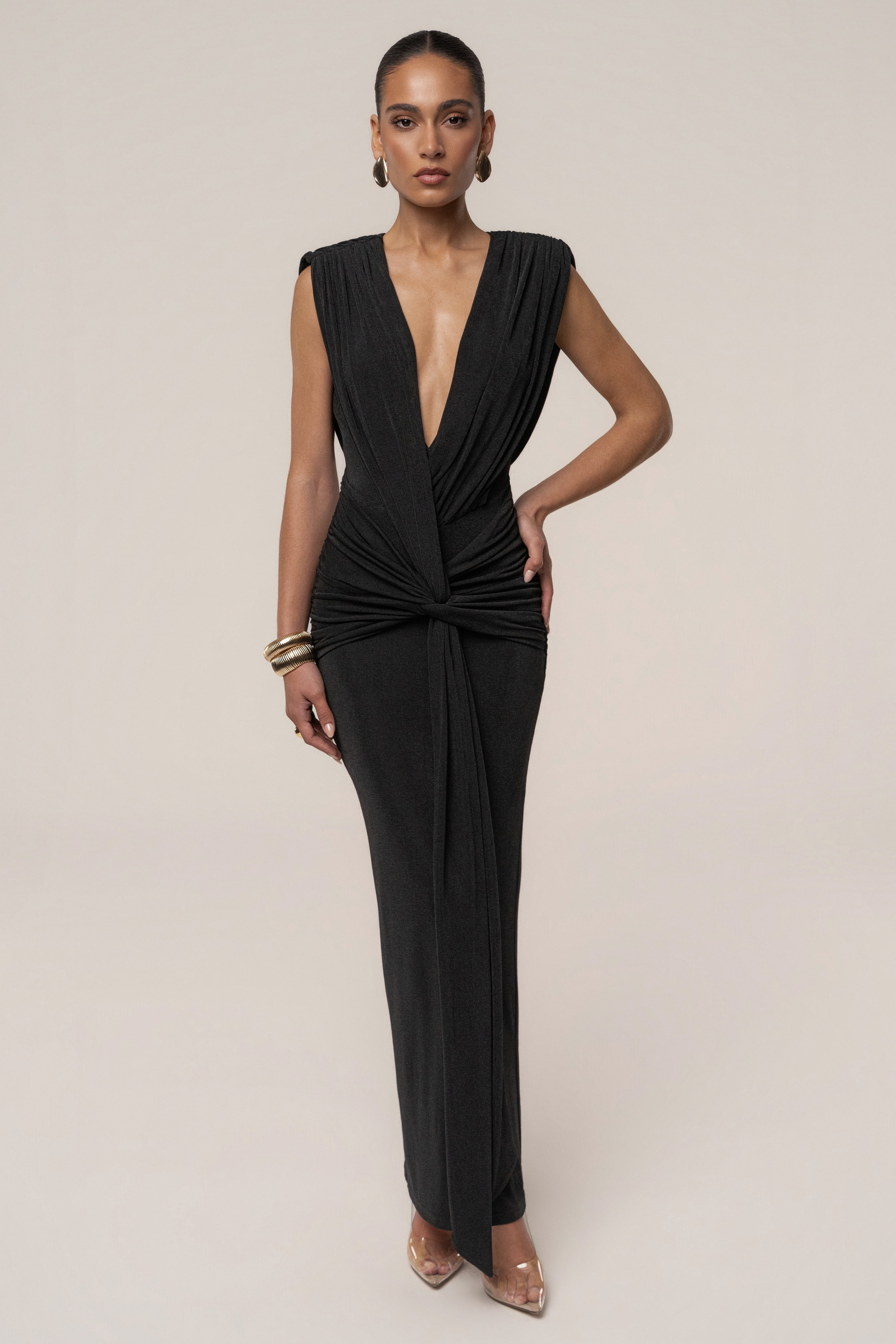 Black Palma Plunge Maxi Dress by JLUXLABEL, featuring a deep V neckline and flowing silhouette, perfect for elegant occasions.