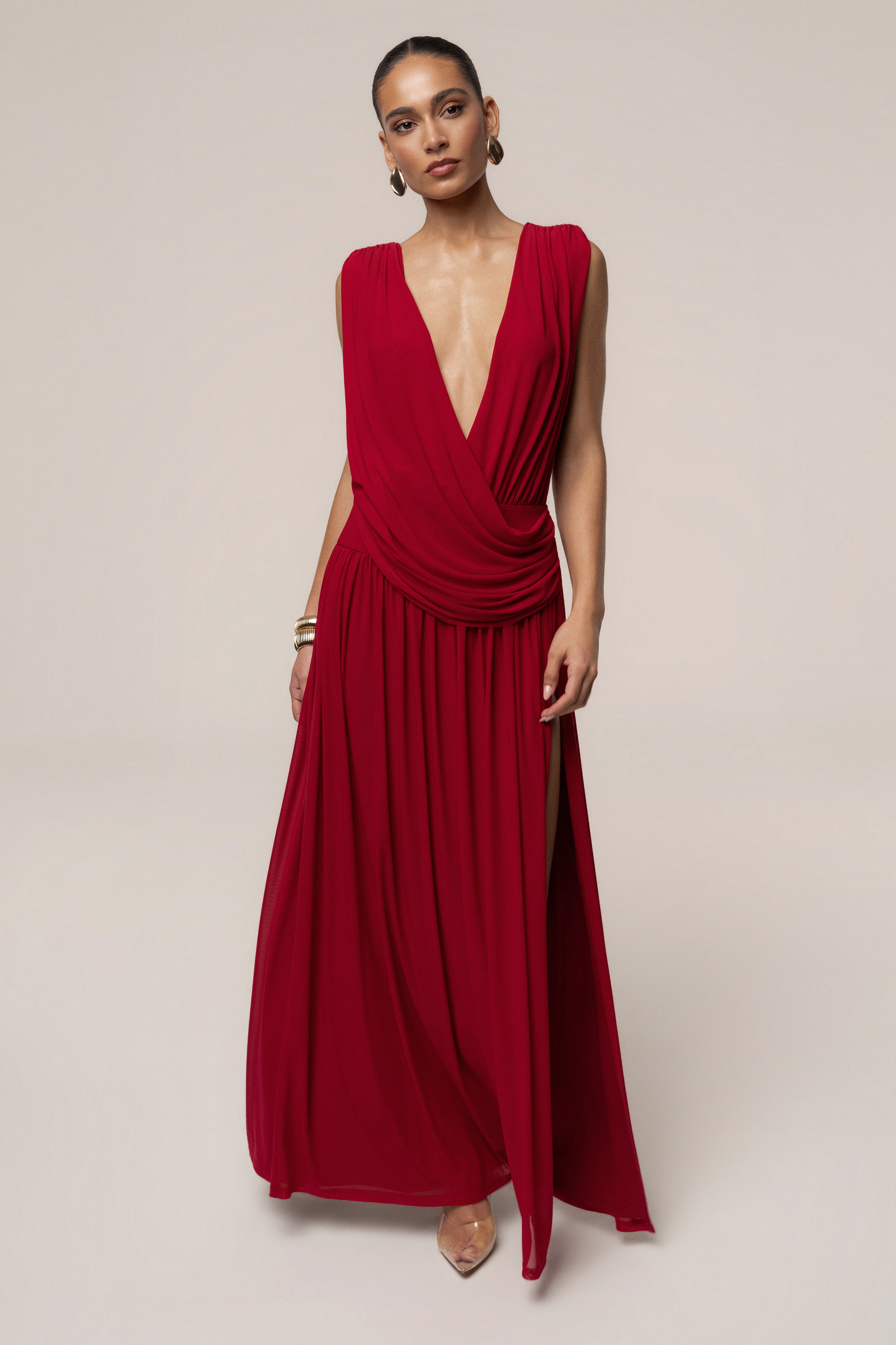Red evening flow draped maxi dress by JLUXLABEL, featuring a graceful silhouette and elegant fabric for formal occasions.