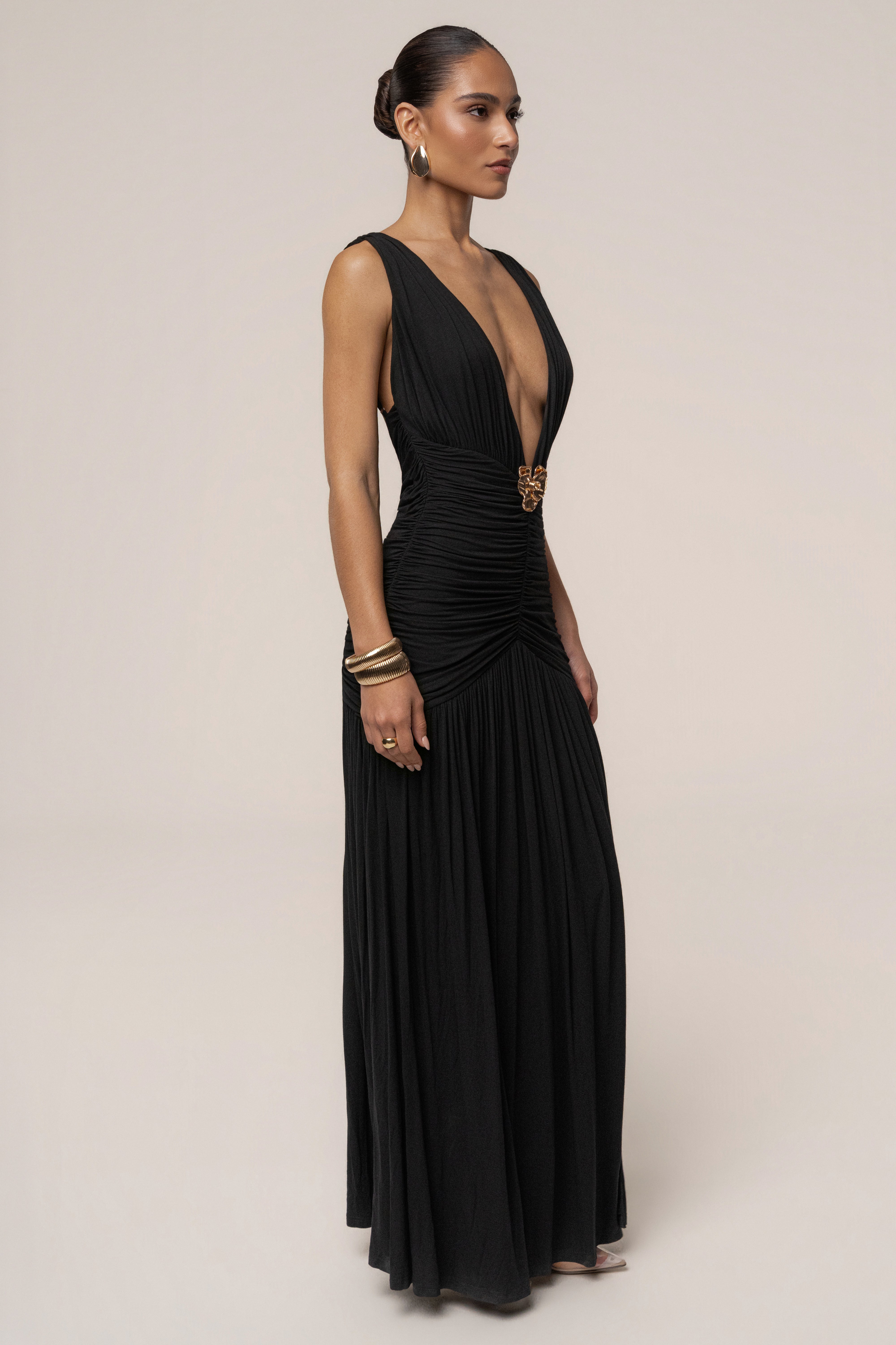 Black and gold halter evening dress by JLUXLABEL, featuring a sleek design and elegant fit for special occasions.