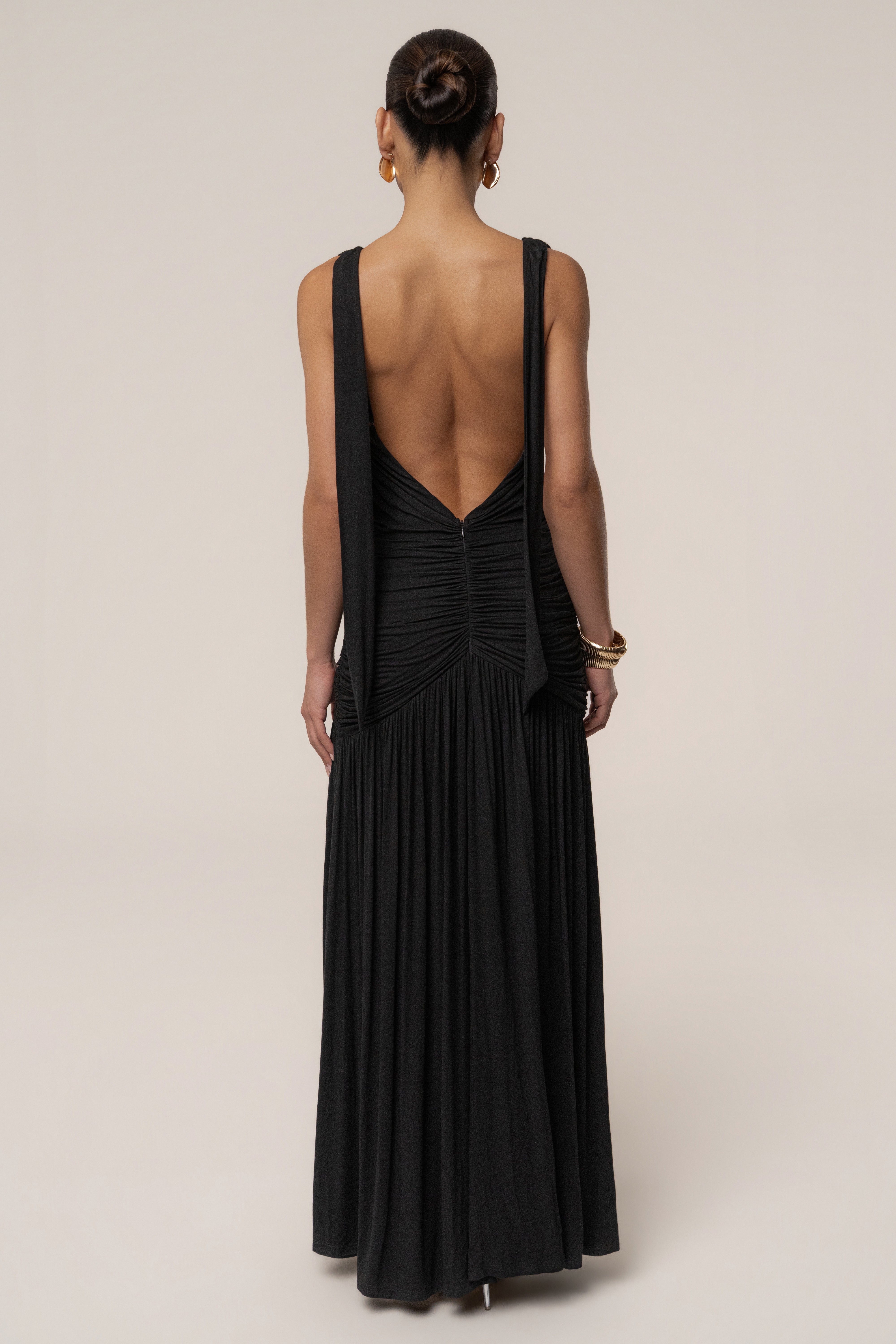 Black and gold halter dress by JLUXLABEL, elegant evening dress featuring a fitted silhouette and stylish halter neckline.