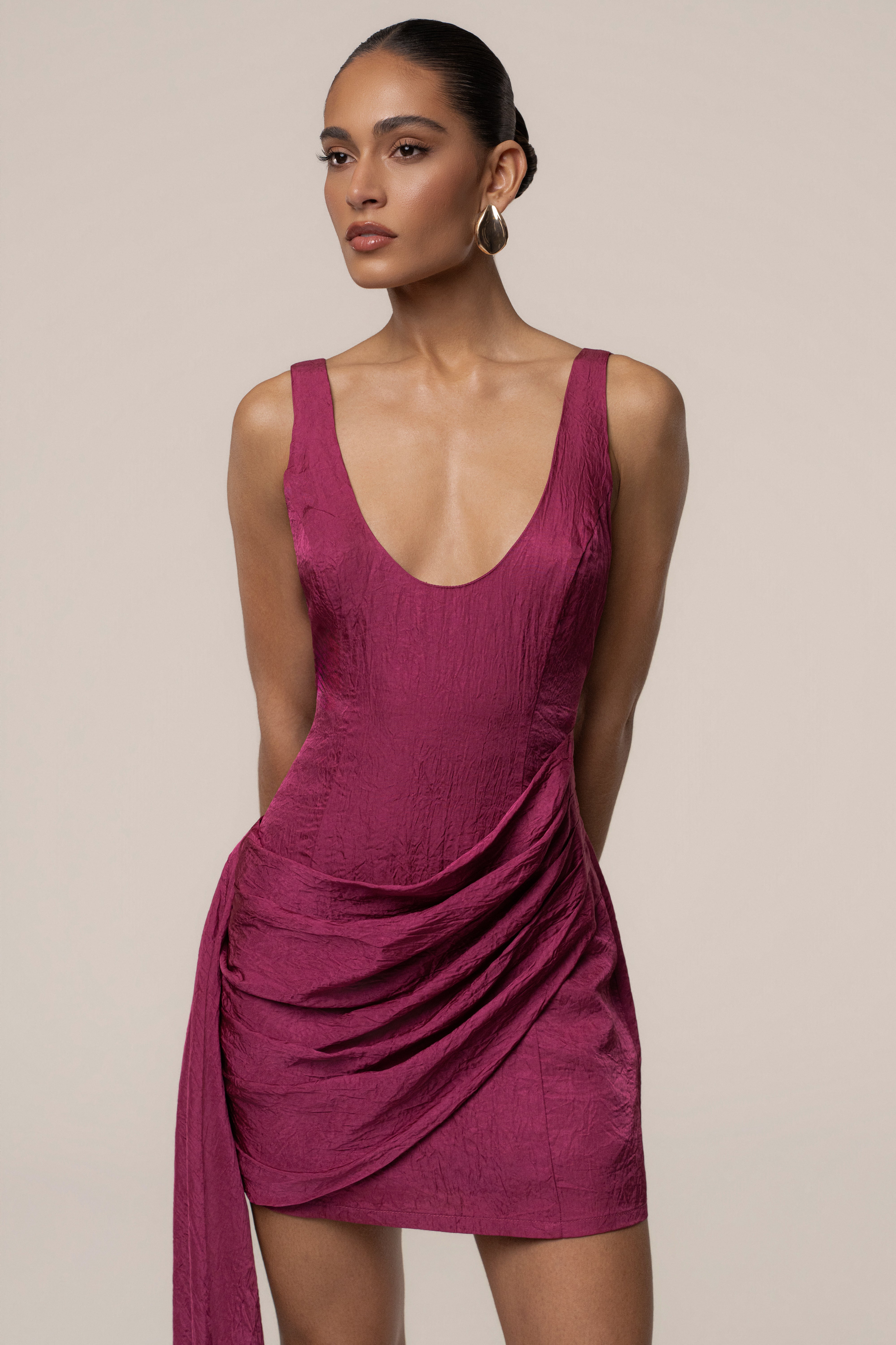 Fuchsia Golden Passage mini dress by JLUXLABEL, featuring a fitted silhouette and stylish design, shown on a model.