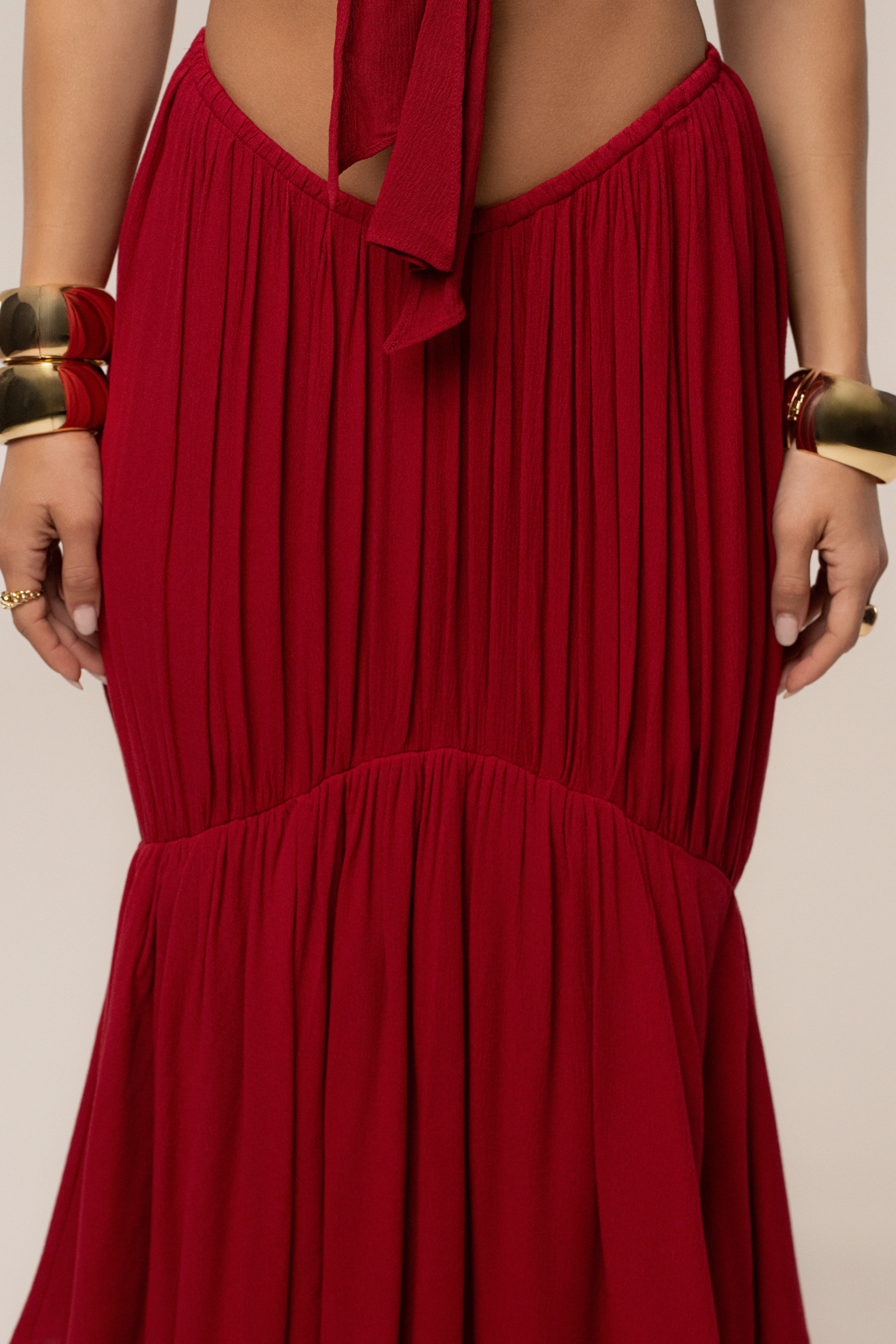 Red Sail Into Sunset skirt set by JLUXLABEL featuring a flowing skirt and matching top in vibrant red.