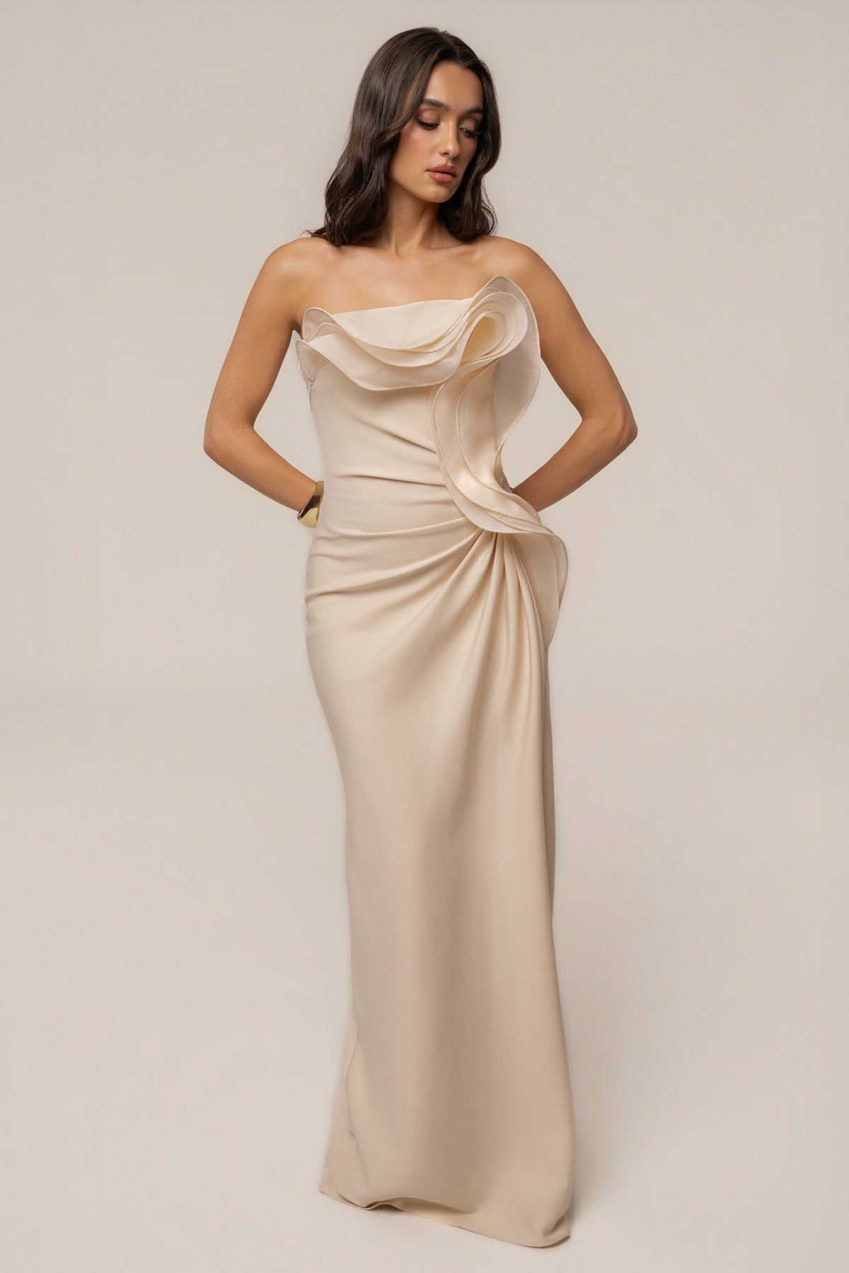 Ivory JLUXLABEL Main Event Maxi Dress displayed on a hanger, showcasing flowing fabric and elegant design for formal occasions.