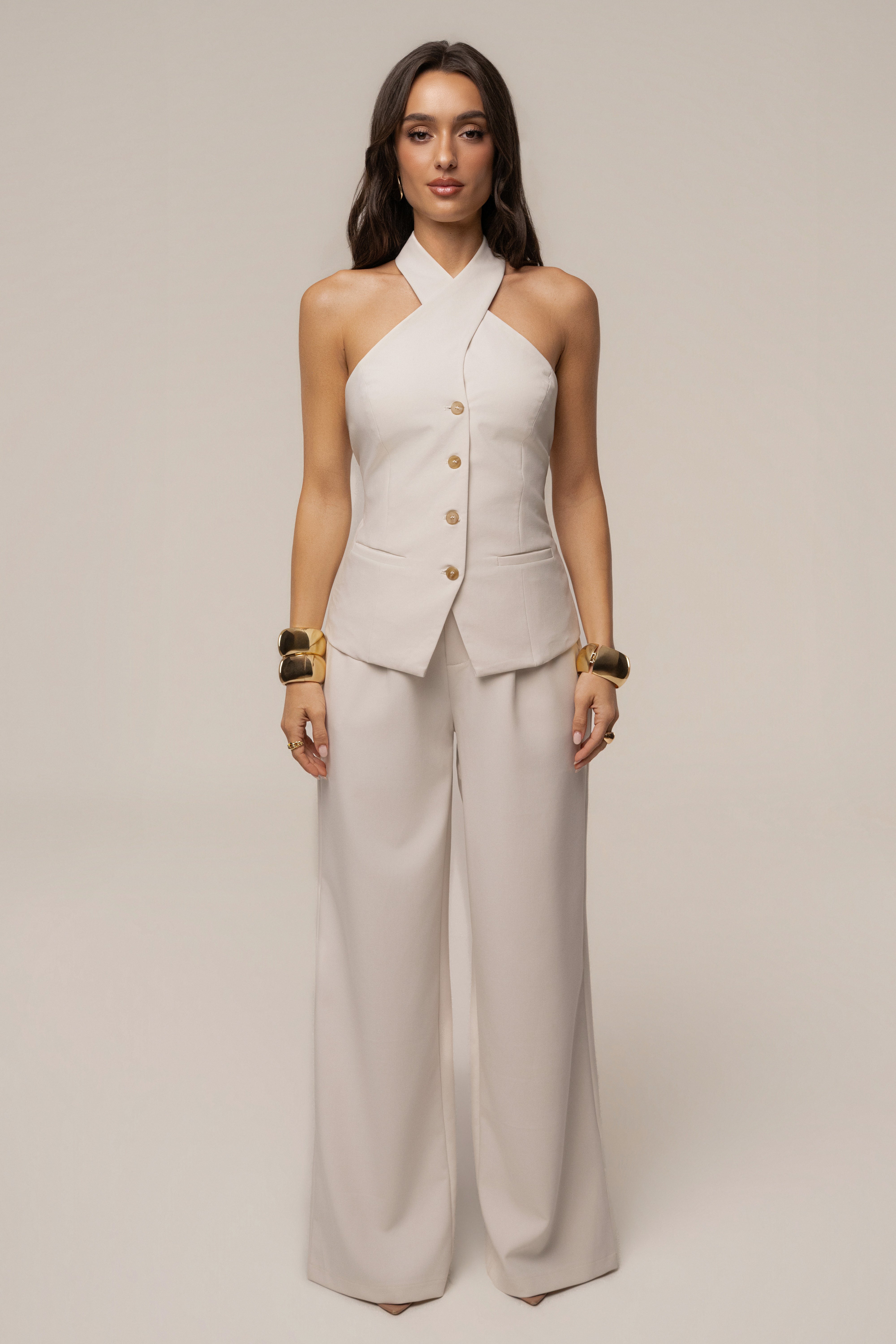Ivory Fernanda halter top by JLUXLABEL, shown in a close-up image highlighting the fabric and halter neckline design.