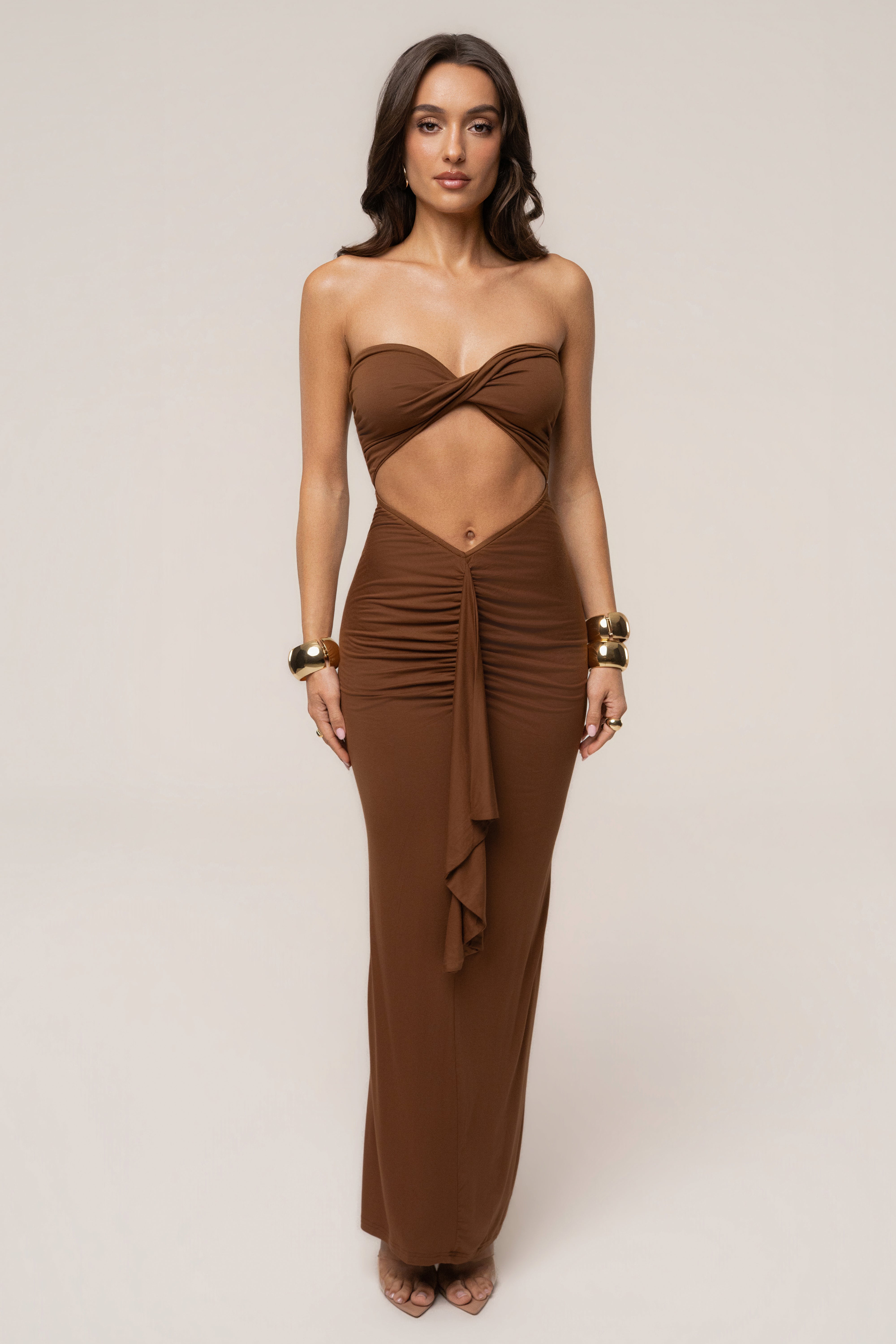 Chocolate strapless drape maxi dress by JLUXLABEL featuring a flowing design and elegant silhouette.
