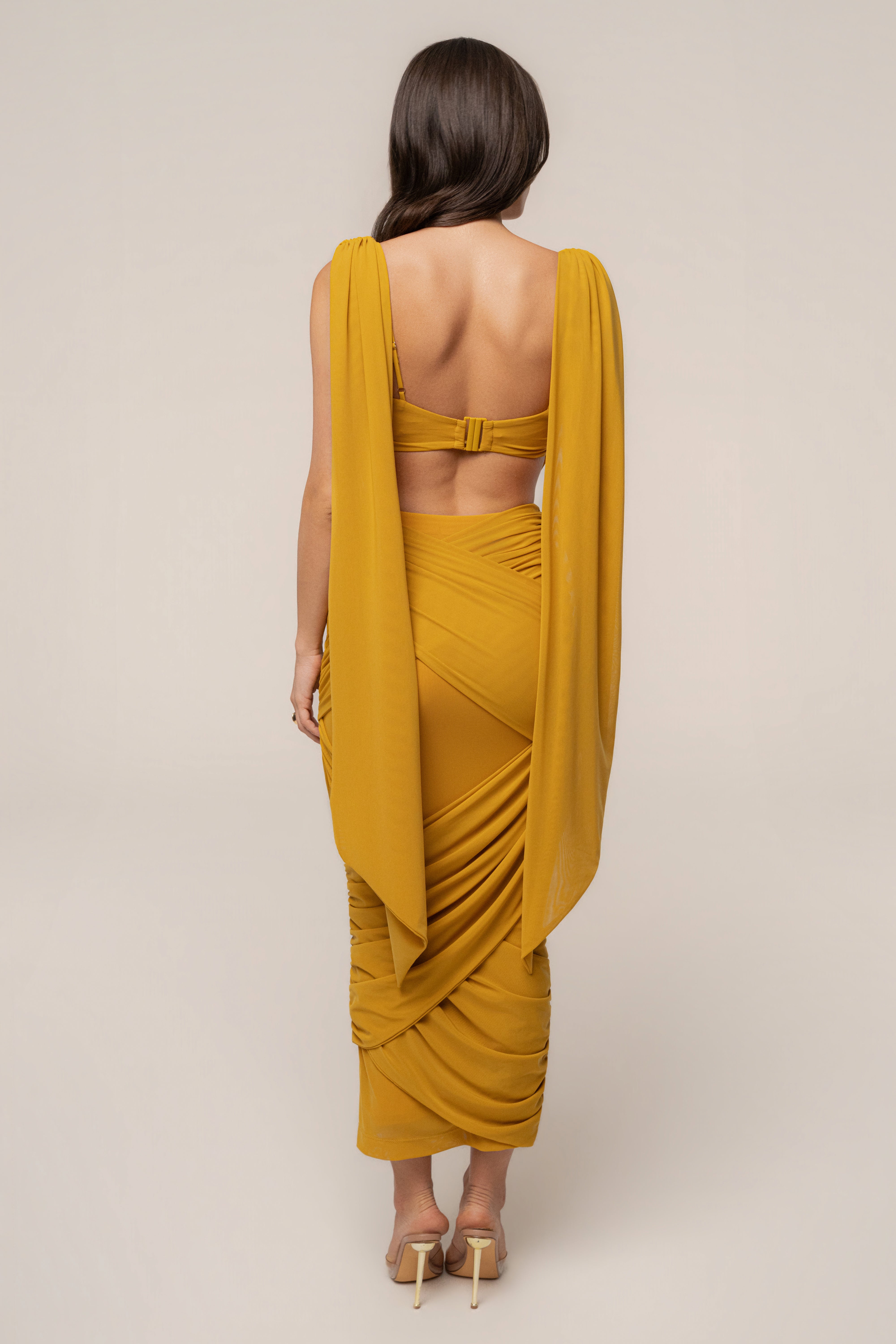 Yellow Divine Drape Mesh Skirt Set by JLUXLABEL featuring a flowing mesh skirt and matching top for a stylish, coordinated look.