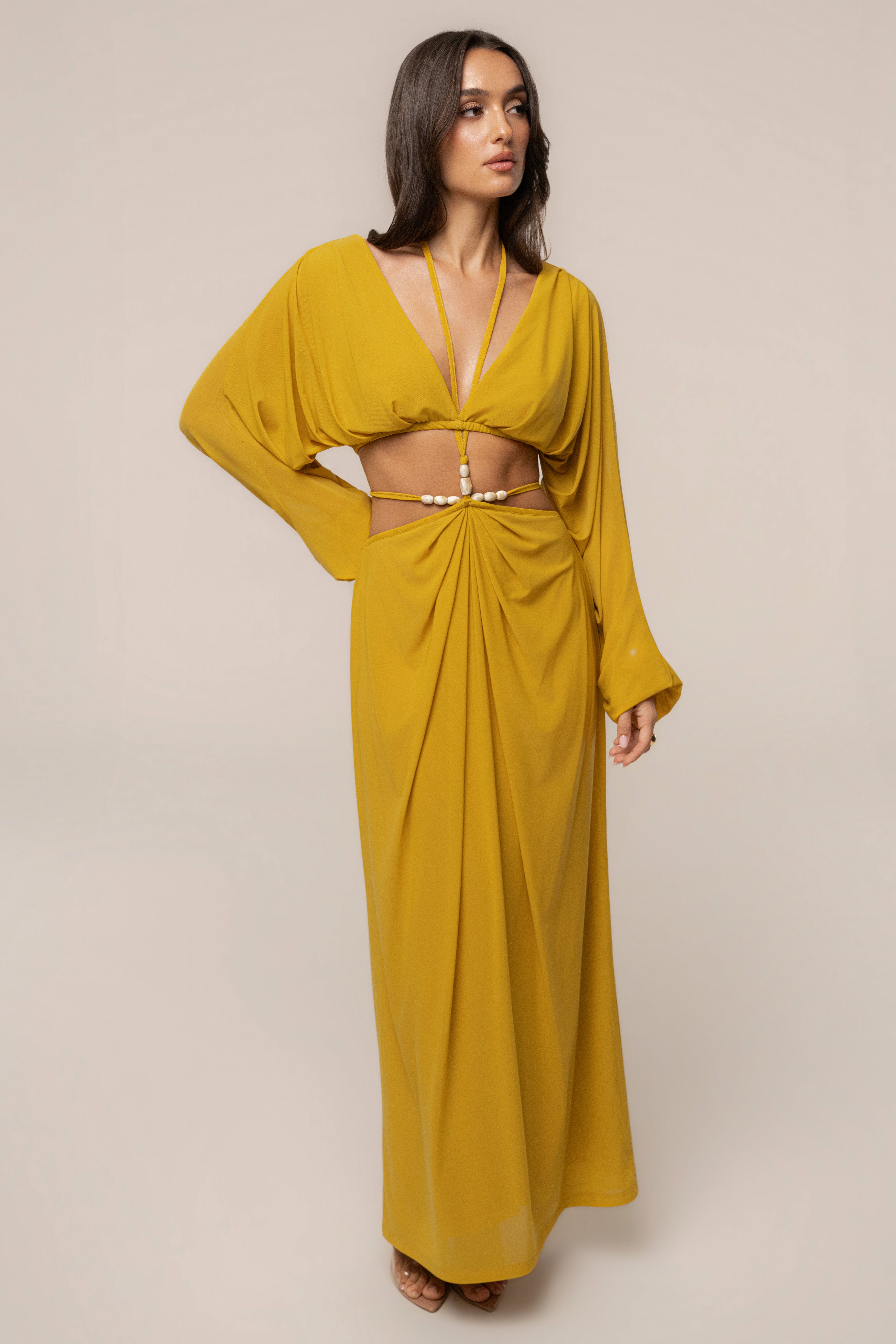 Mustard Hera Draped Maxi Skirt by JLUXLABEL, flowing fabric with draped details, styled as a stylish bottom for elegant summer looks.