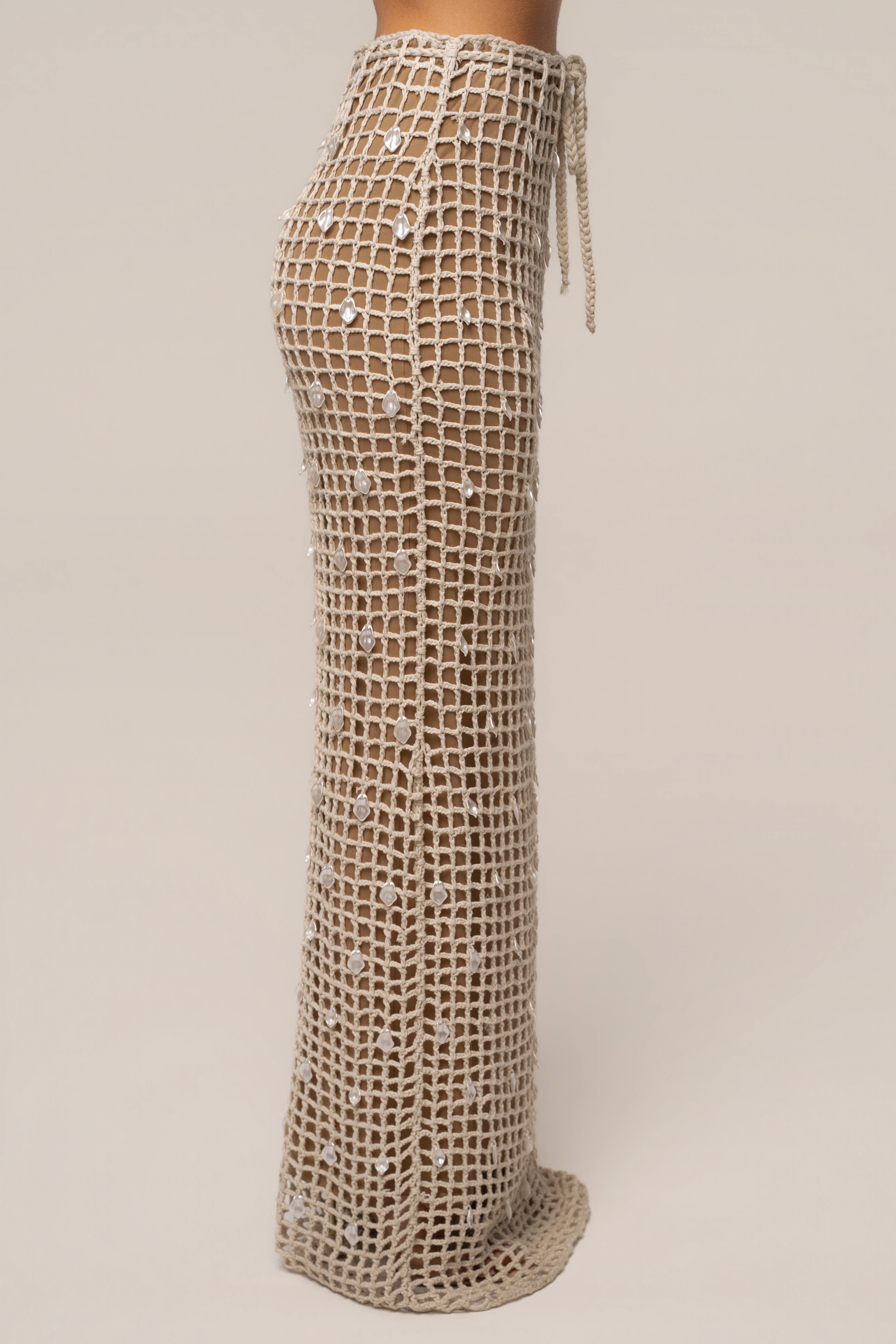 Ecru Pearl Shore crochet skirt from JLUXLABEL featuring intricate crochet design and pearl accents, perfect for stylish summer wear.