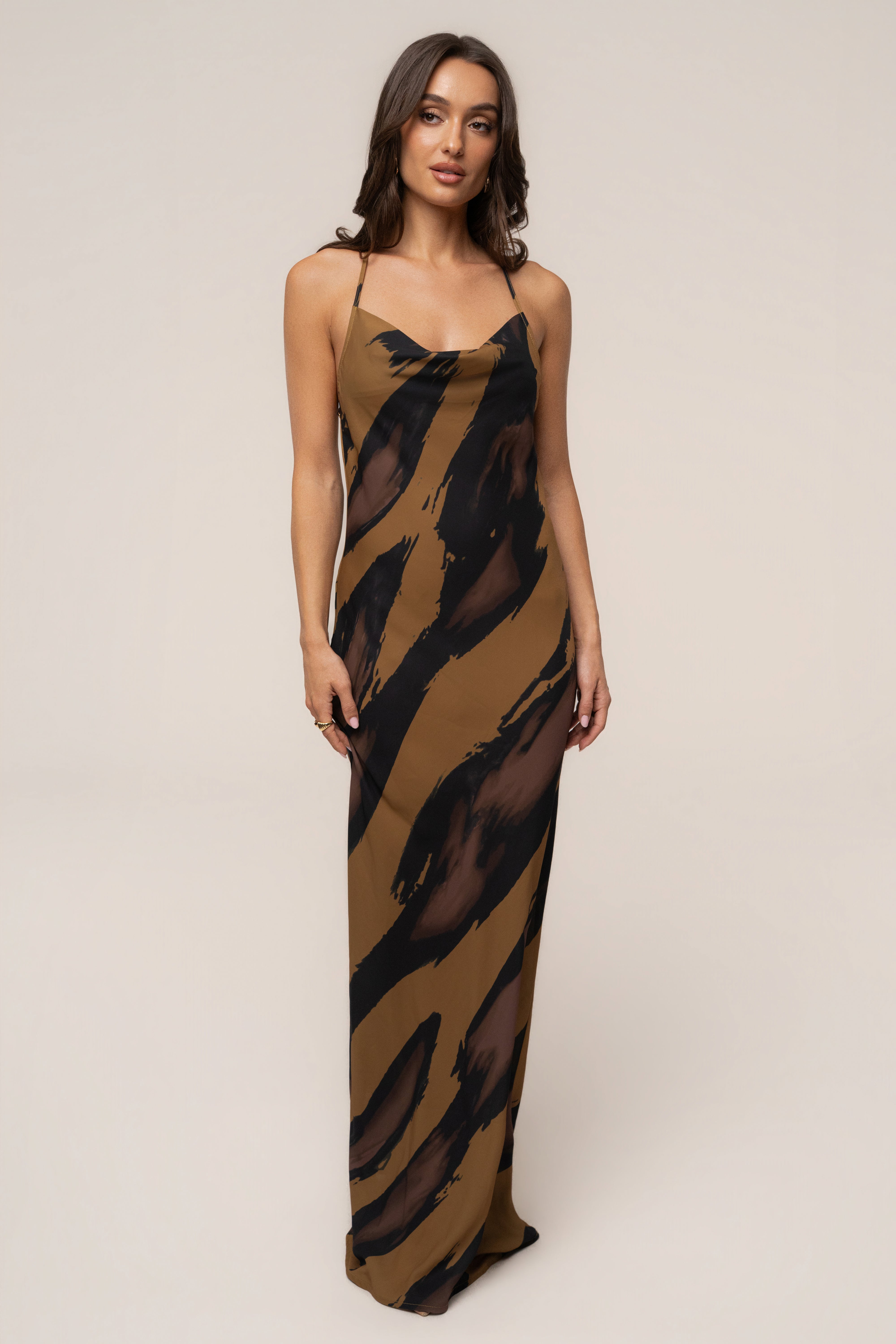 Gold Dusk Infinite Journey maxi dress by JLUXLABEL, flowing fabric with elegant gold-toned details and a stylish, relaxed fit.