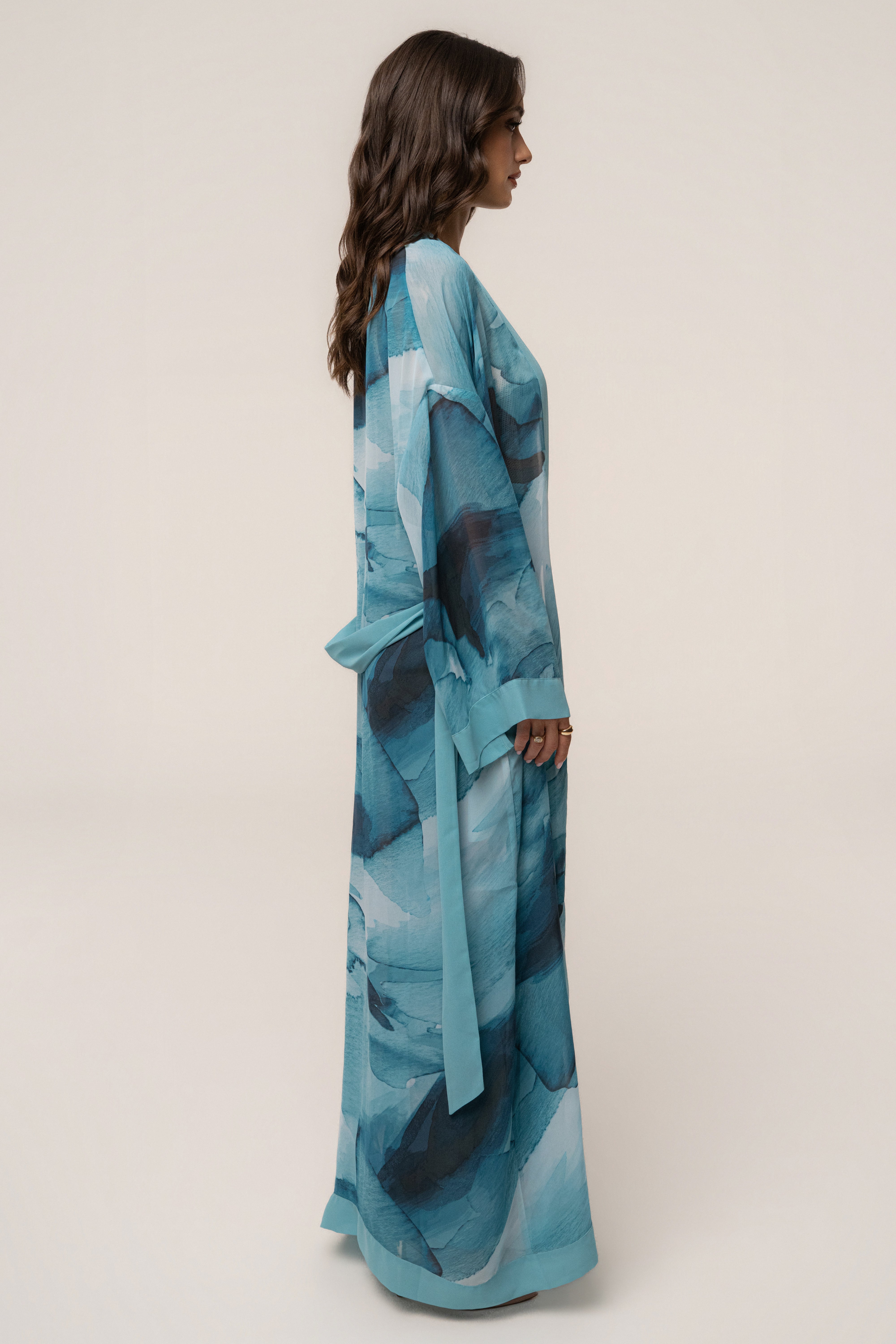 Blue abstract printed duster jacket by JLUXLABEL, featuring a stylish flowing outerwear design with vibrant pattern details.