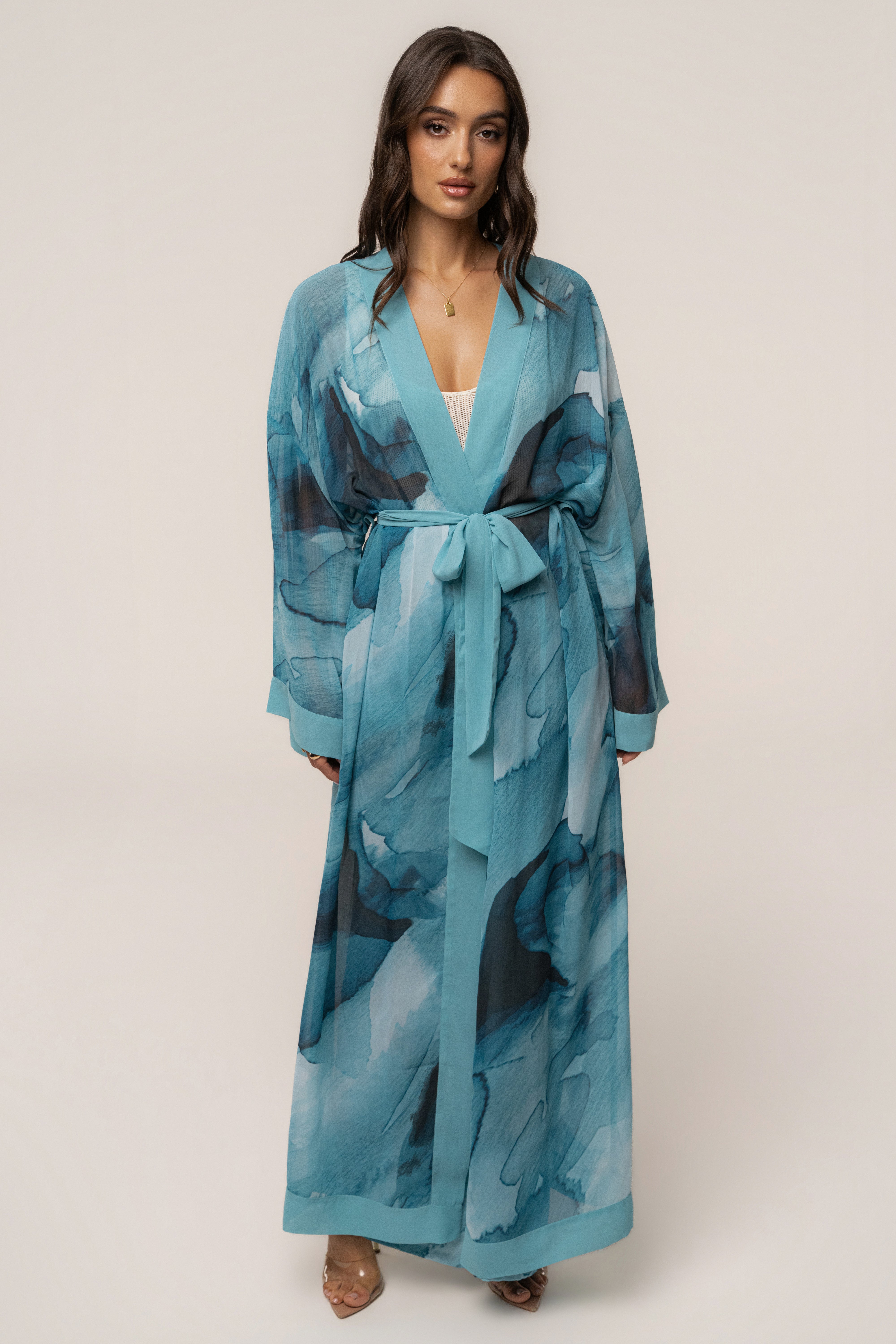 Blue abstract printed duster outerwear by JLUXLABEL with a flowing, lightweight design and vibrant artistic pattern.