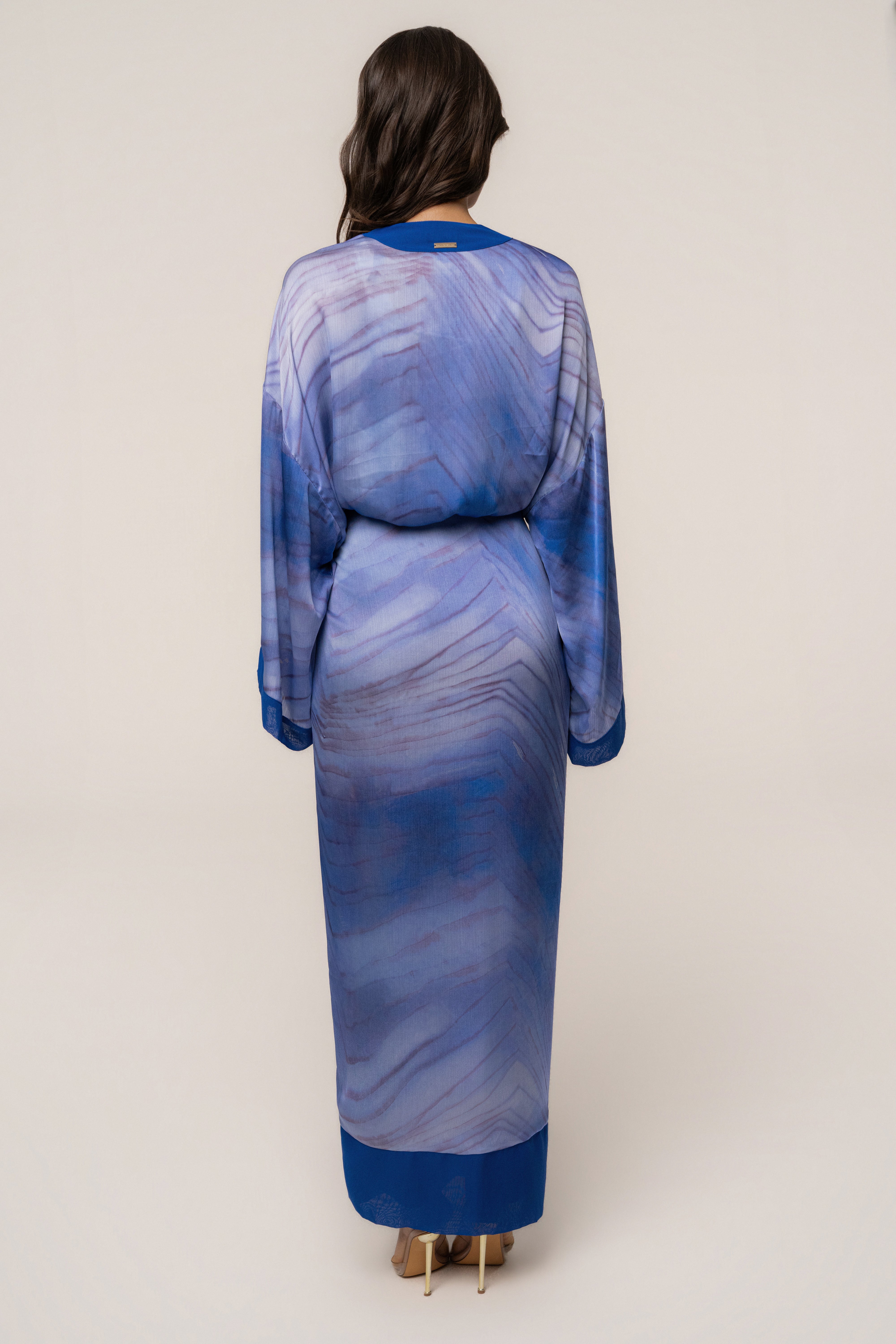 Blue Bahía satin duster outerwear by JLUXLABEL, shown as a flowing, lightweight satin coat with long sleeves and a relaxed fit.