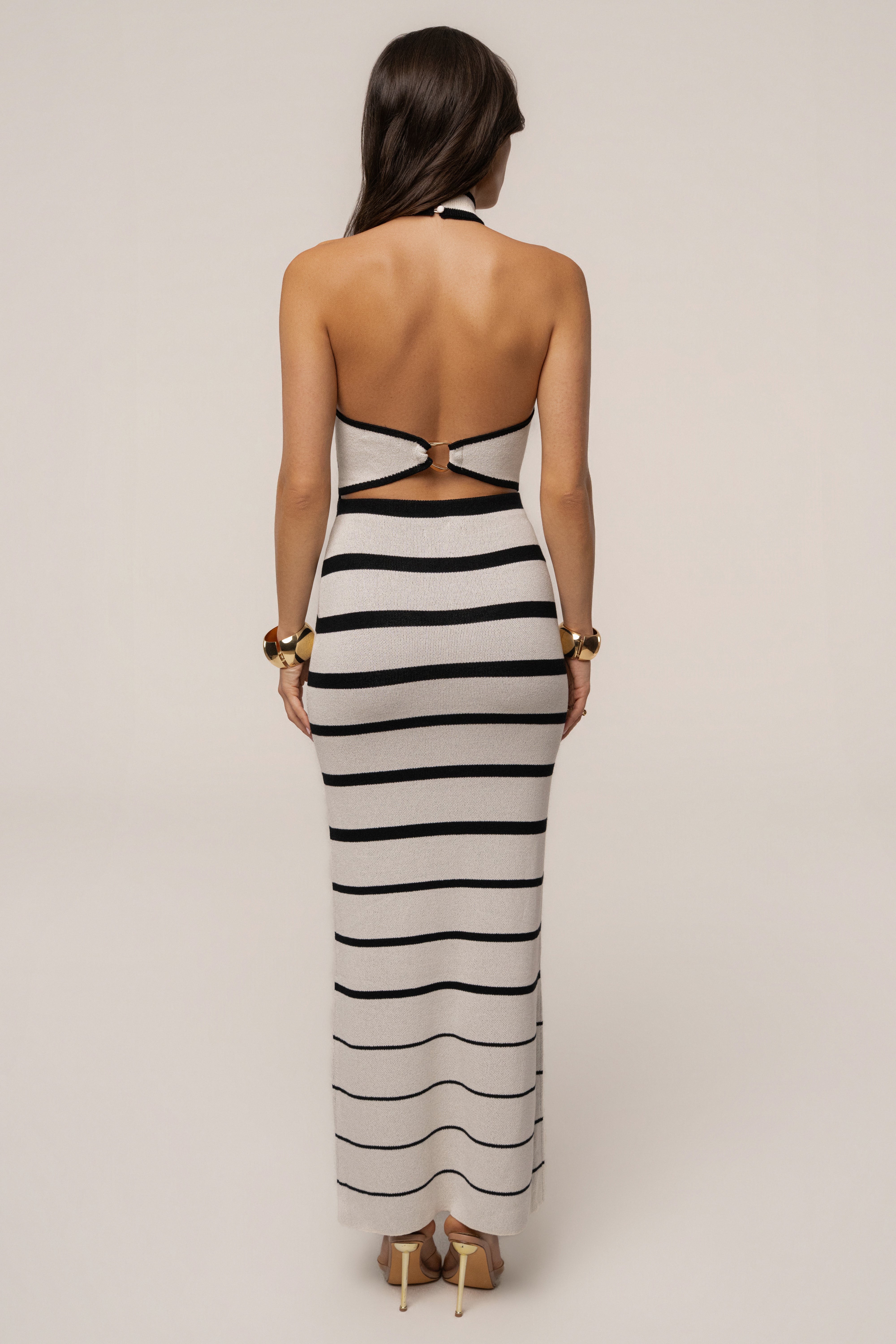 White and black striped Marina Nights skirt set by JLUXLABEL, featuring a stylish coordinated top and matching skirt.