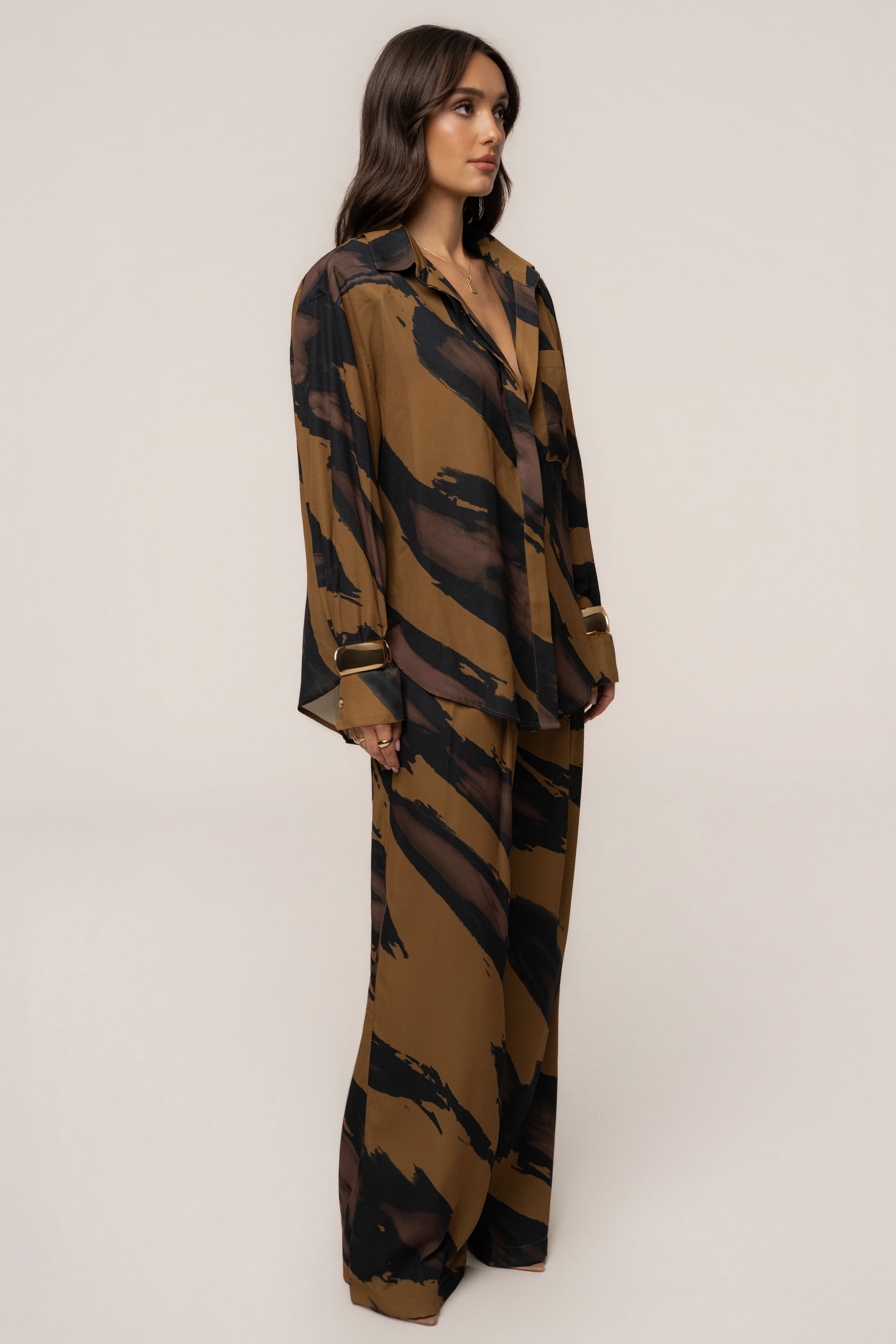 Gold Dusk Fierce Form button-down shirt by JLUXLABEL, featuring a stylish gold-toned design, shown on a model.