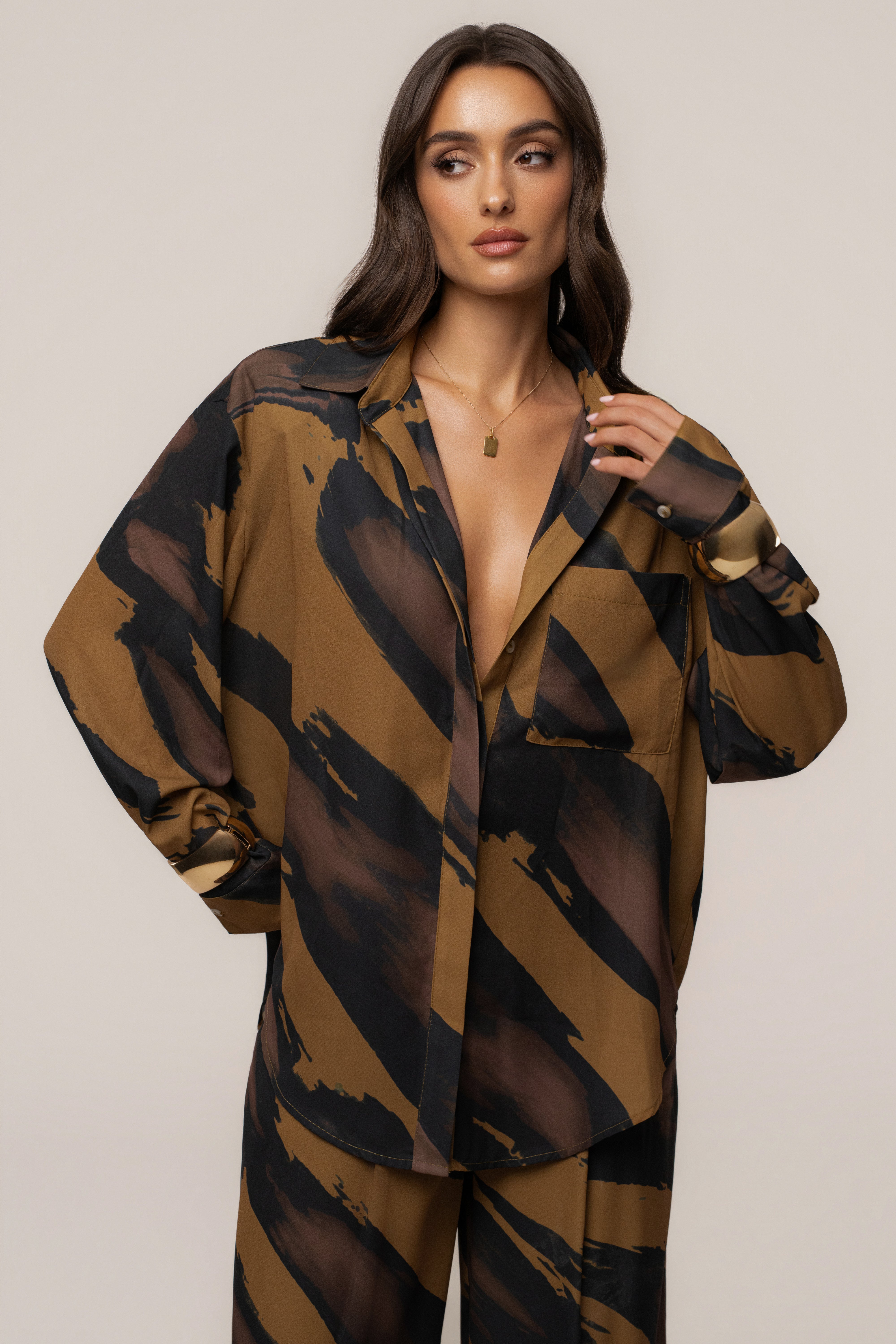 Gold Dusk Fierce Form button-down shirt from JLUXLABEL, showcasing a stylish tops design with a sleek, fitted silhouette.