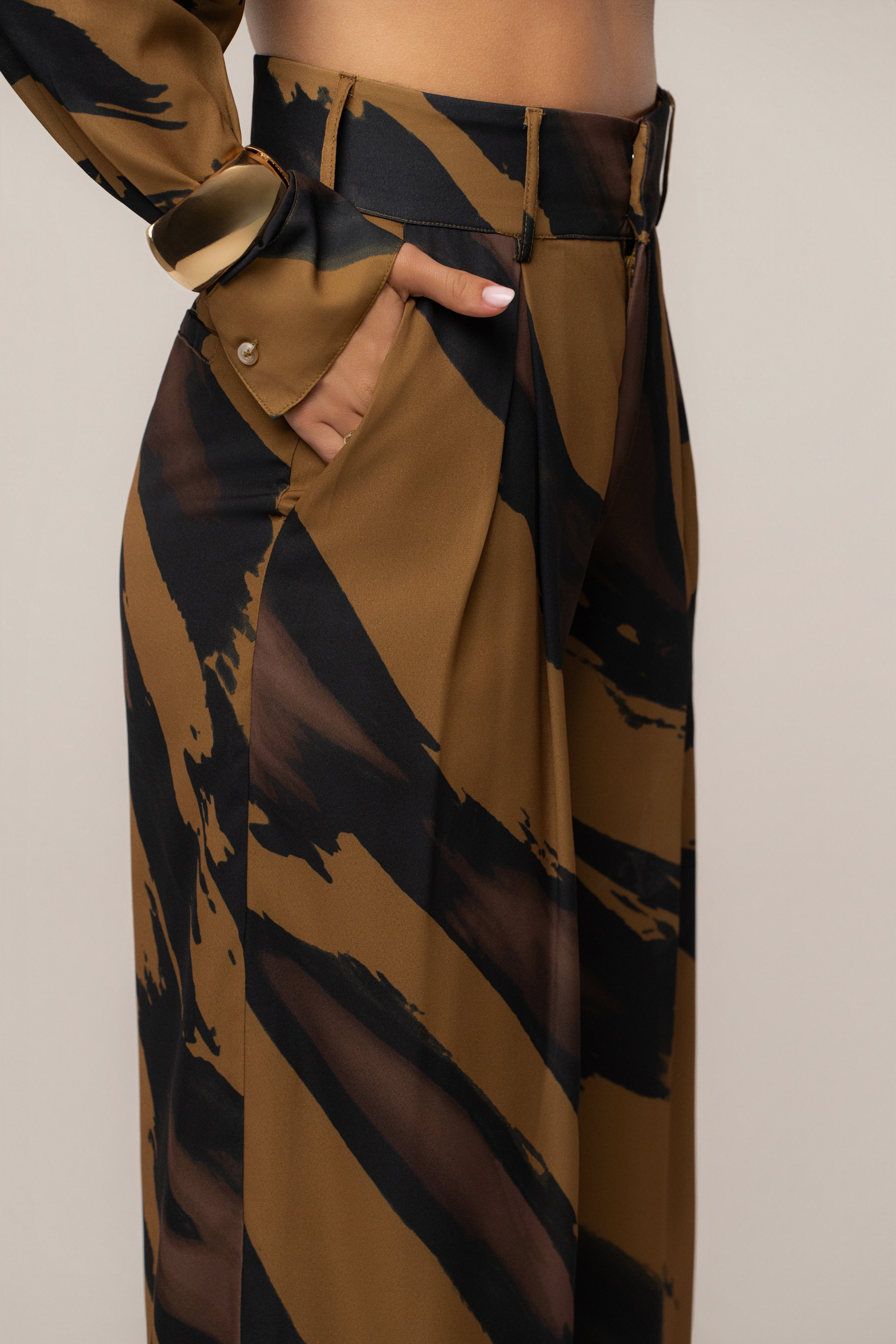 Gold Dusk soft pleated trousers by JLUXLABEL, stylish bottoms with a relaxed fit and elegant pleats.