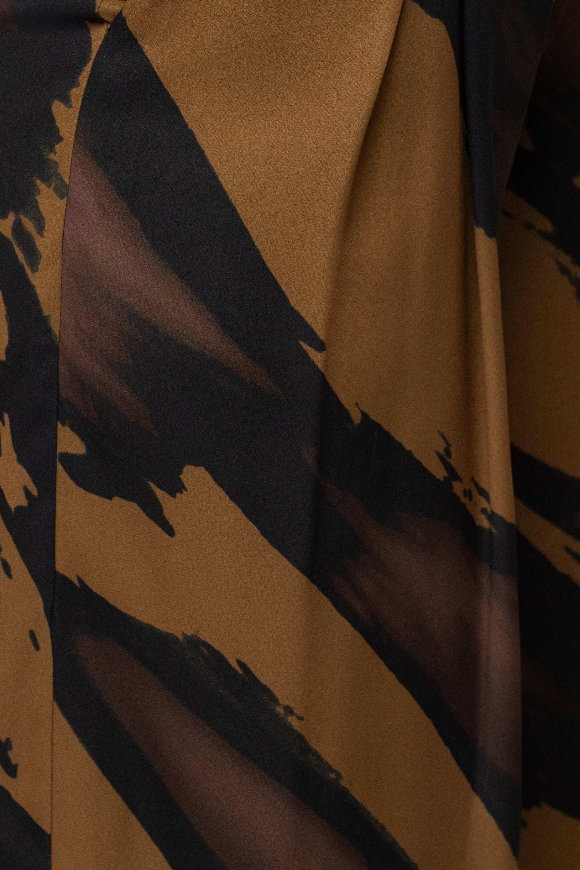 Gold Dusk soft pleated trousers by JLUXLABEL, stylish bottoms with a relaxed fit and elegant pleats, shown on a model.