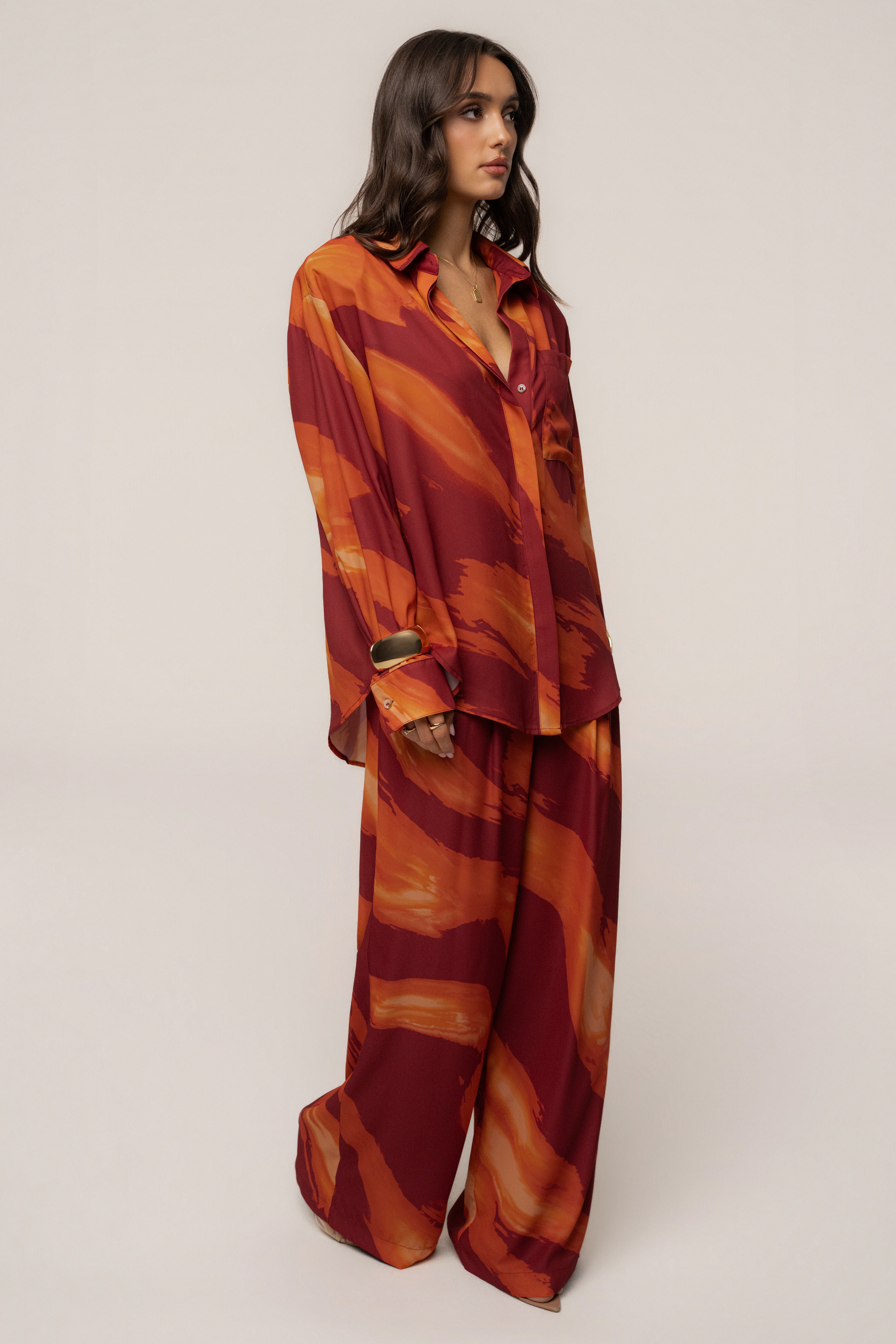 Crimson Dusk fierce form button-down shirt by JLUXLABEL, featuring a stylish fit and bold color, worn as a casual top.