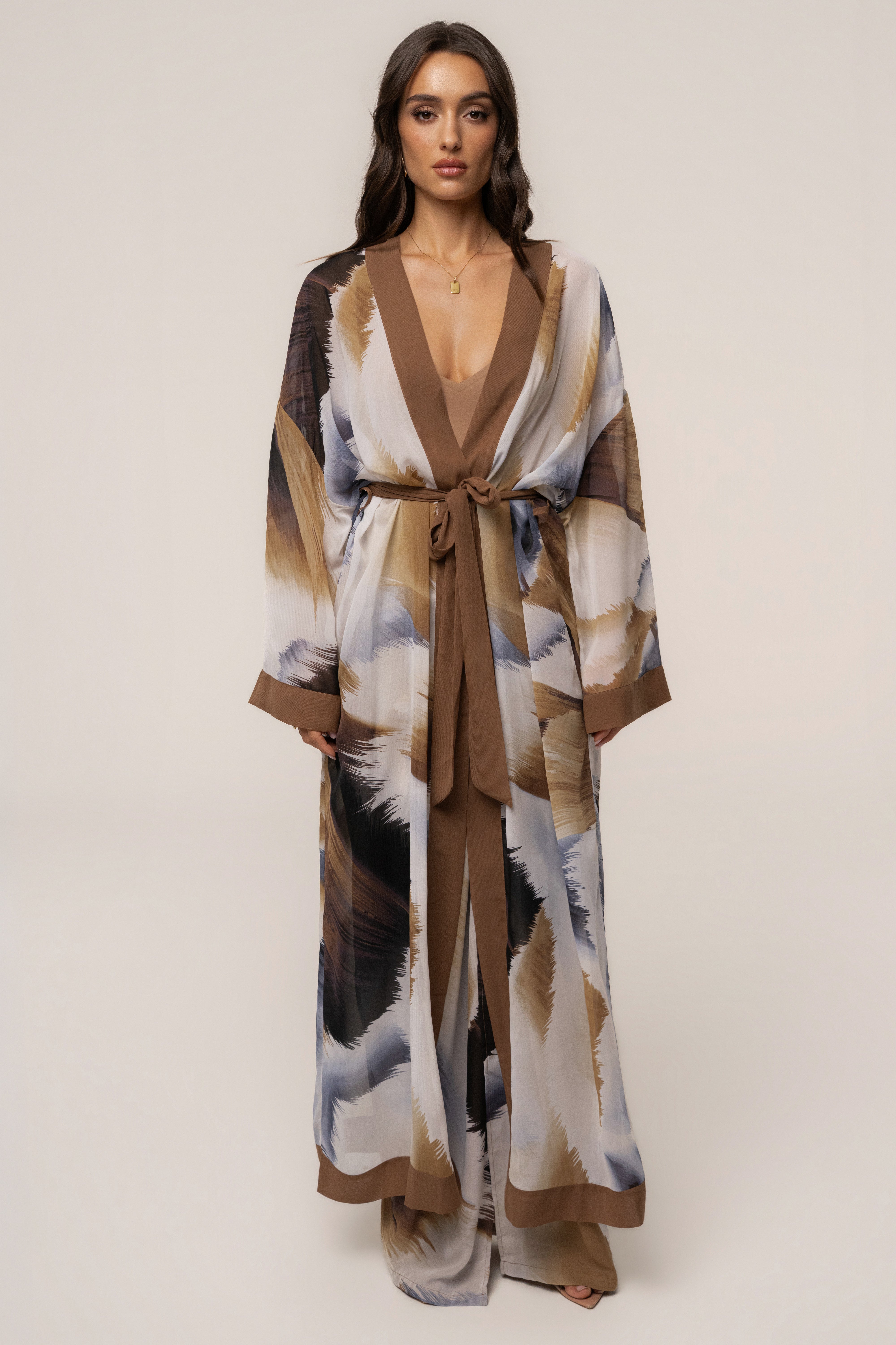 Brown abstract printed duster outerwear by JLUXLABEL featuring a flowing, lightweight design with a modern artistic pattern.