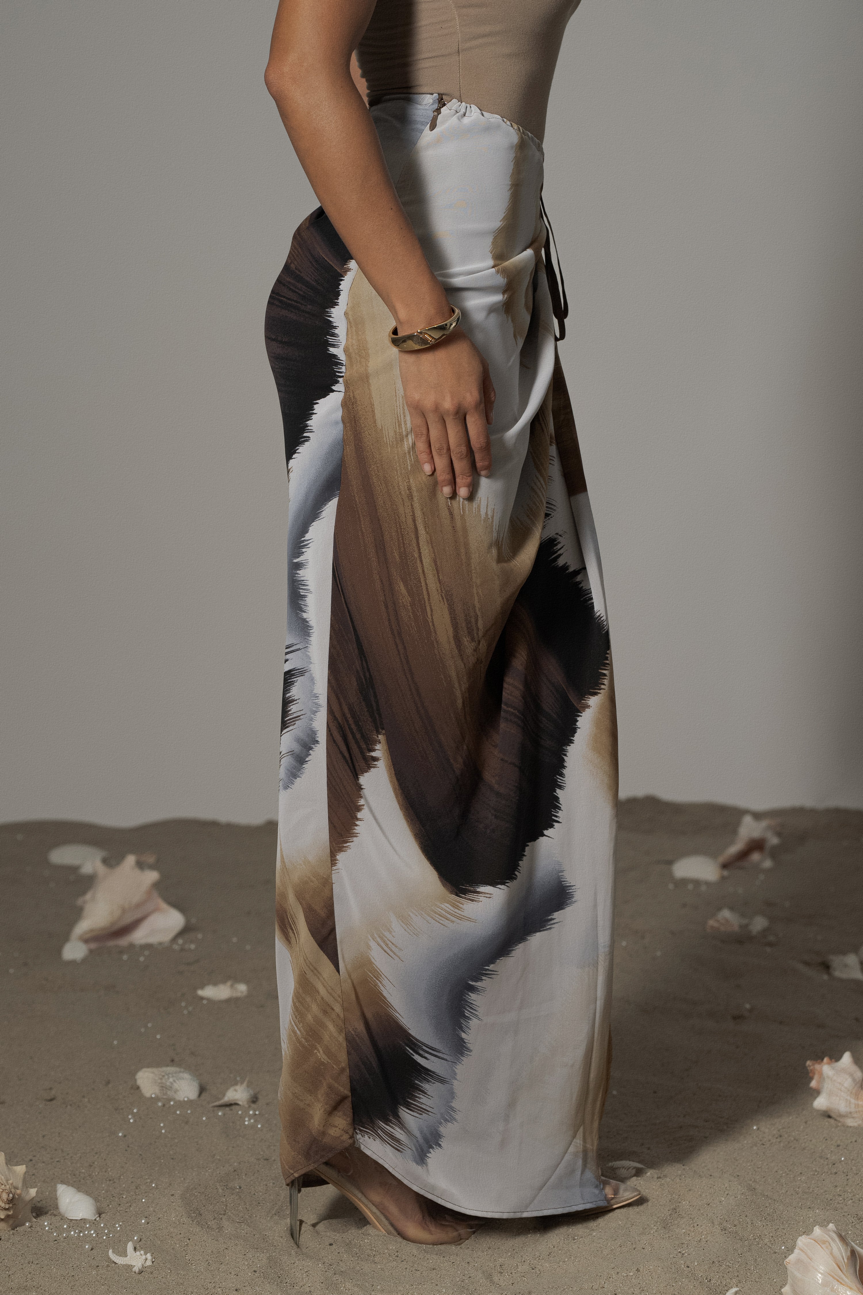 Brown abstract printed Noelia skirt from JLUXLABEL, styled as a stylish bottoms piece with a flowy, artistic design.