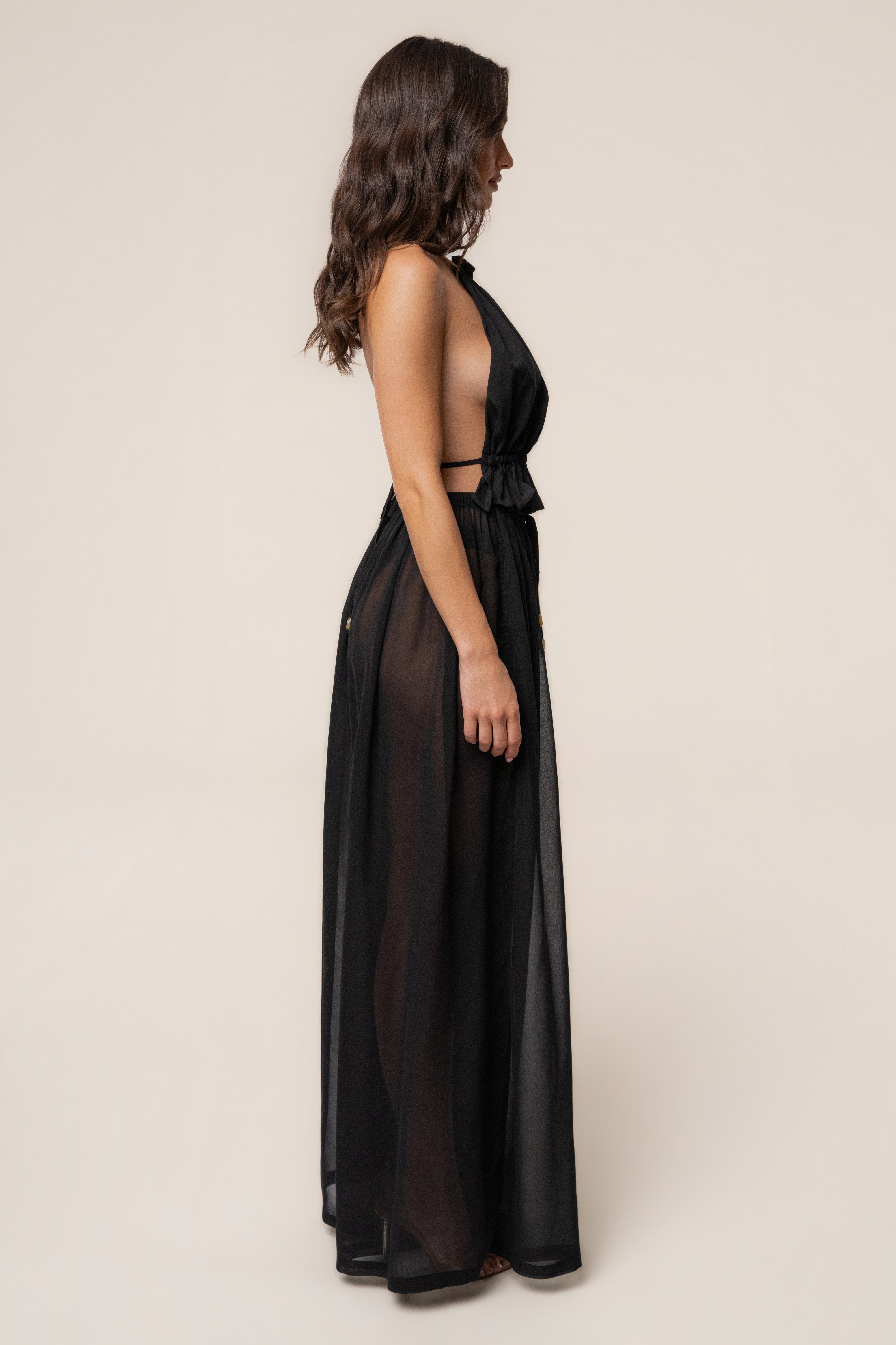 Black resort glow chiffon pants by JLUXLABEL, featuring lightweight flowy fabric and wide-leg design for a stylish summer look.